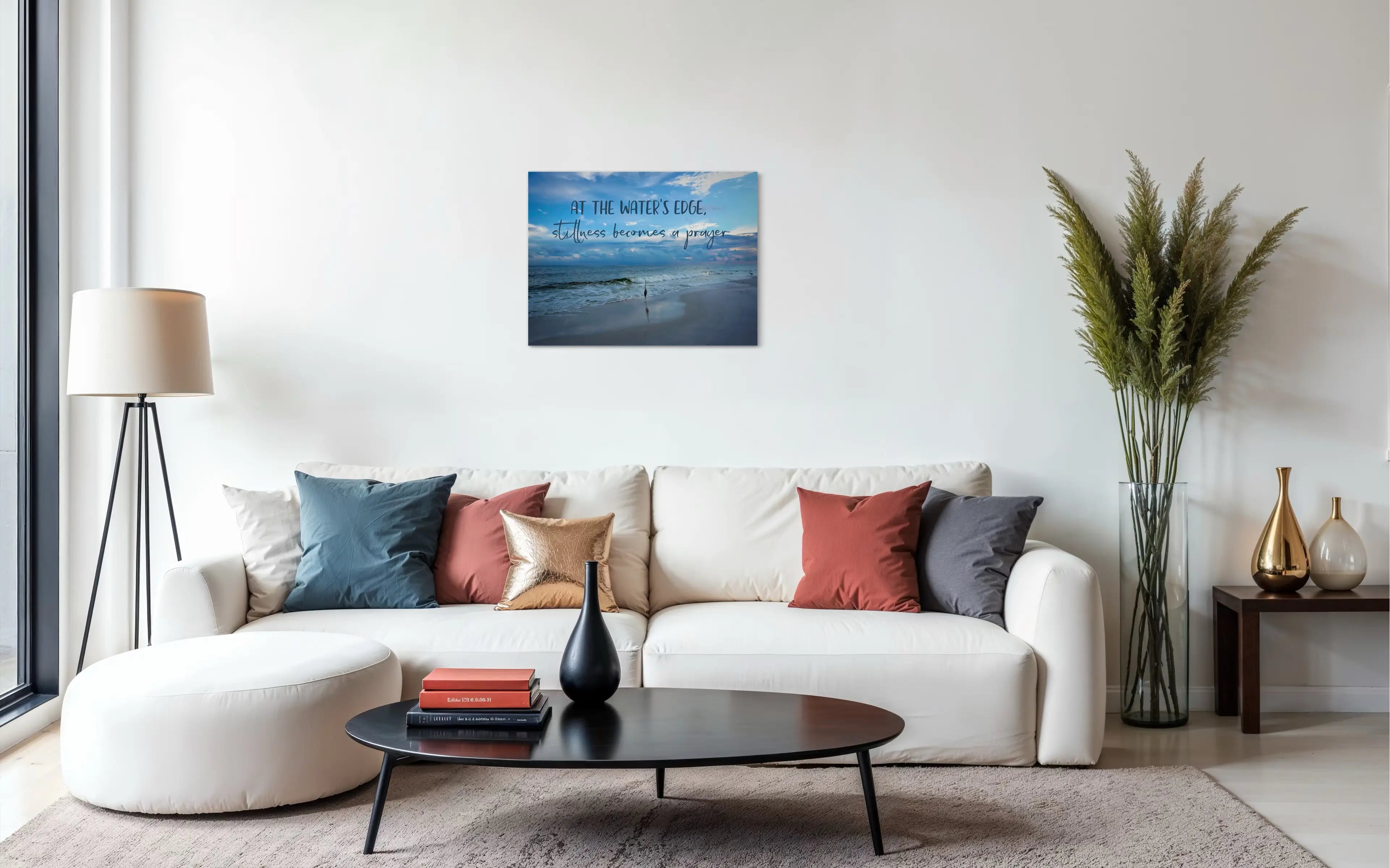 At the water’s edge, stillness becomes a prayer" heron coastal glass wall art print — inspirational ocean quote décor for modern beach homes.