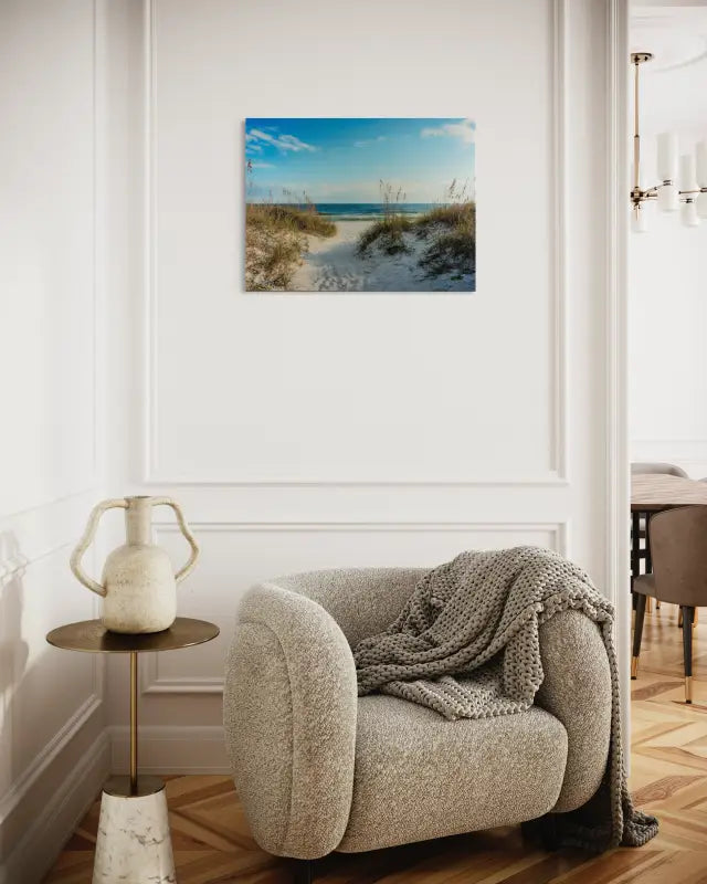 A glass print featuring a pathway winding through white sand dunes with sea oats, leading to a calm ocean horizon-seating area