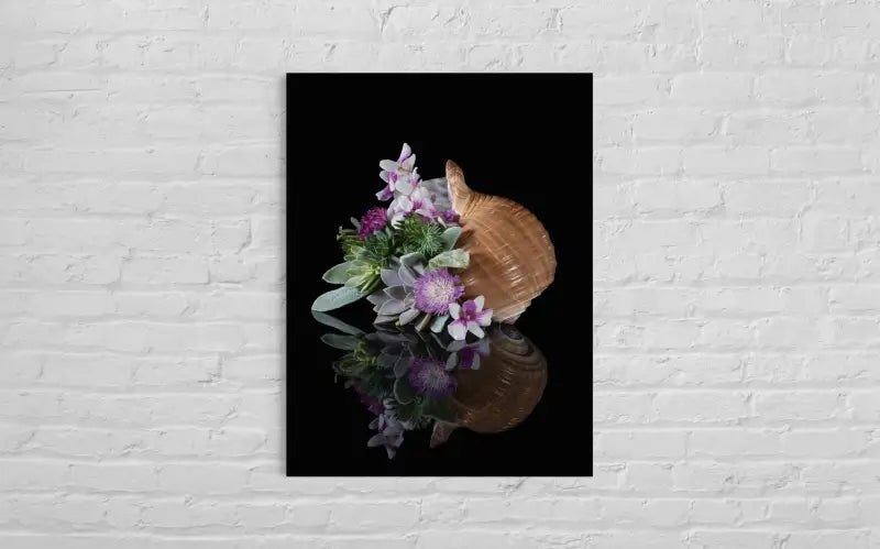 Ocean wall art glass print with tunna shell, succulents, and purple orchids on black background, coastal wall decor