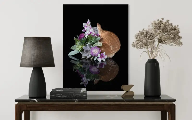 Ocean wall art glass print with tunna shell, succulents, and purple orchids on black background, coastal wall decor