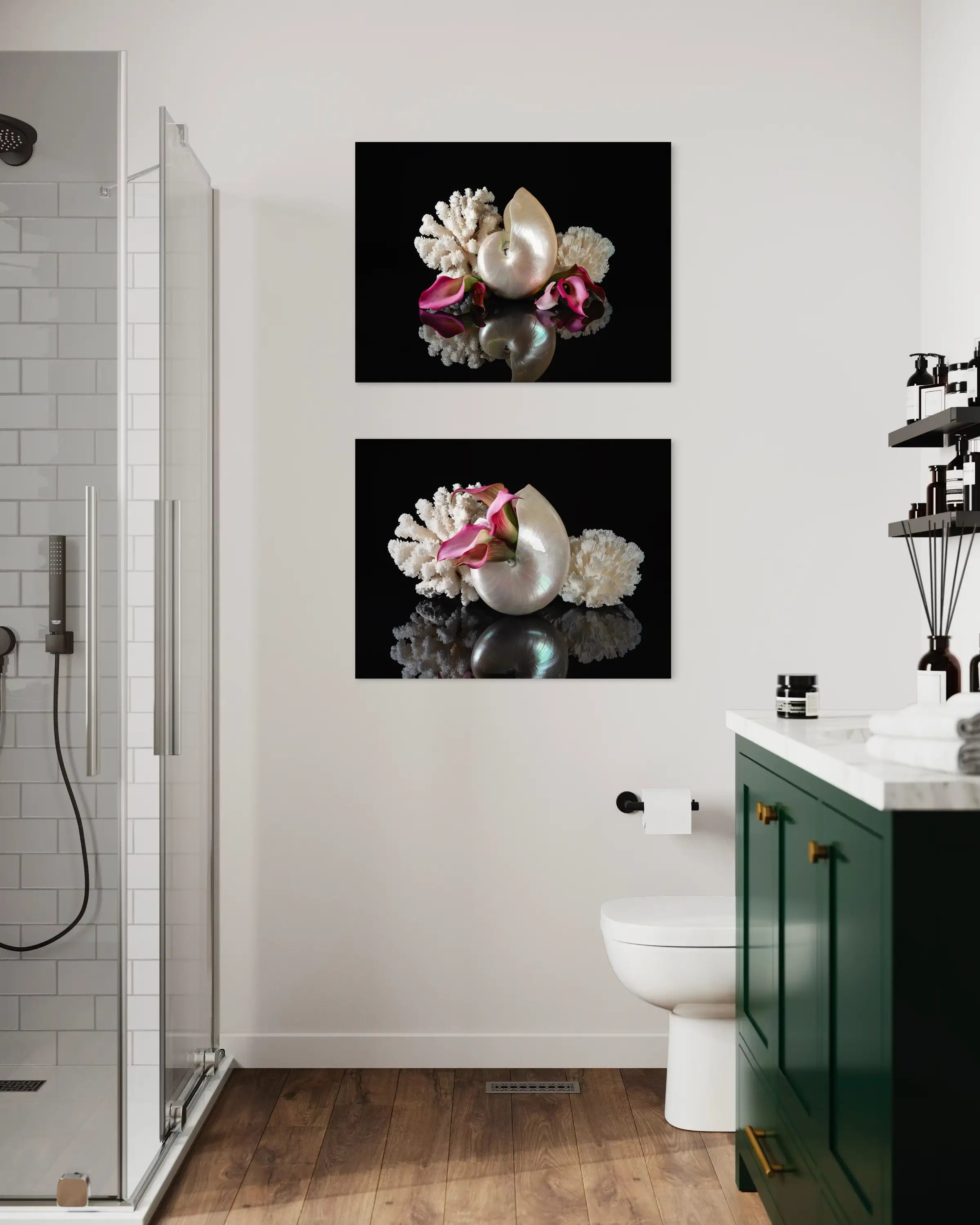 Two matching coastal glass print of a pearl nautilus, coral and pink lilies on black reflective background for ocean bathroom wall art.