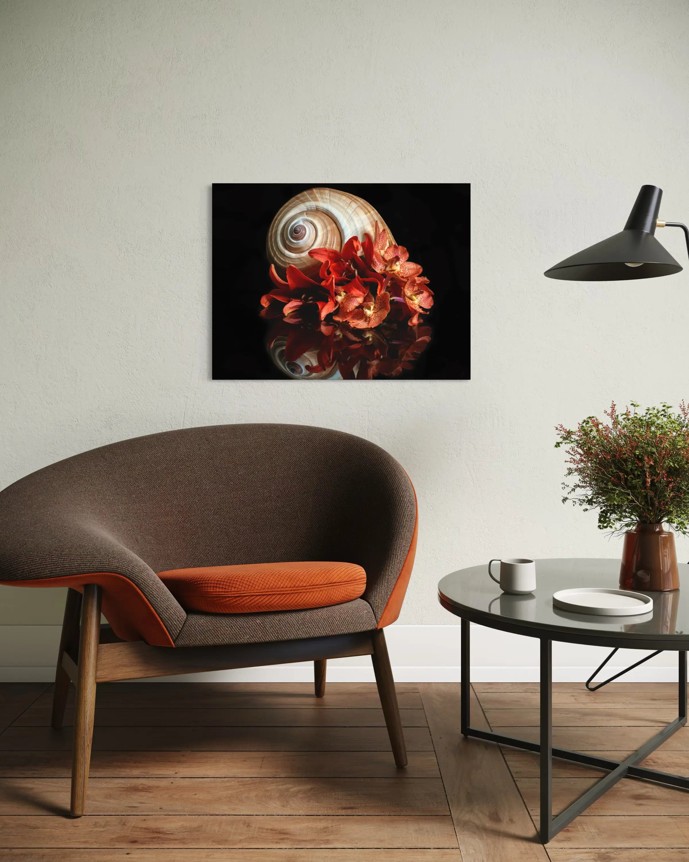 Giant ton shell and Orange lilies coastal glass print in a cozy sitting area.
