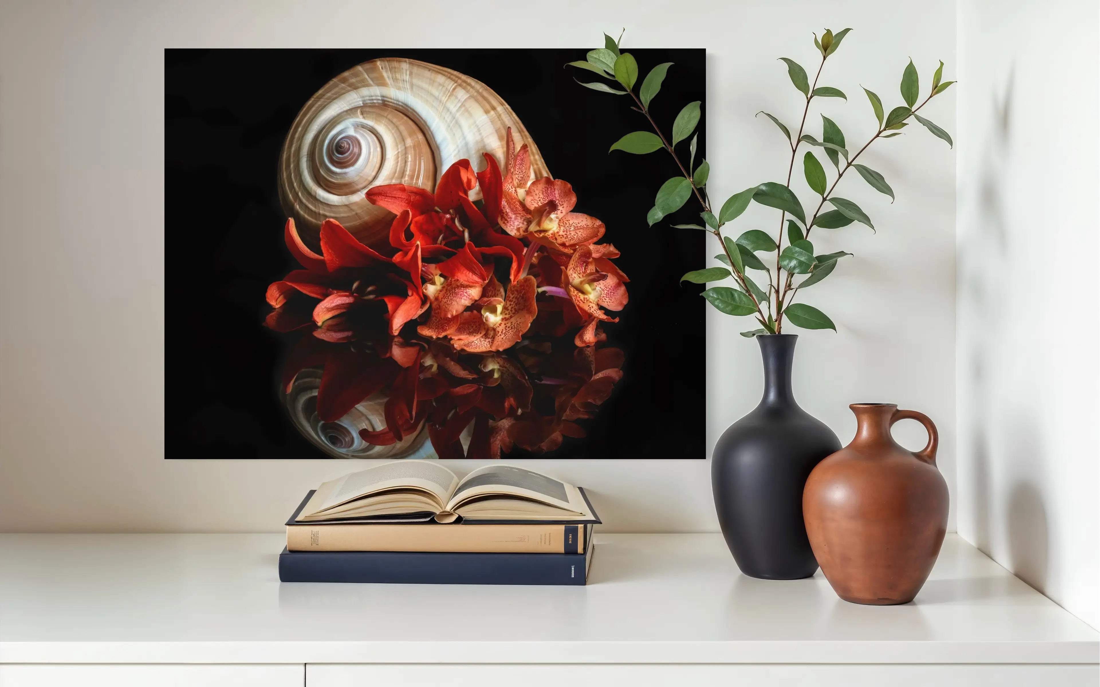 Coastal glass print of orange lilies and giant ton shell on black reflective background pictured in niche