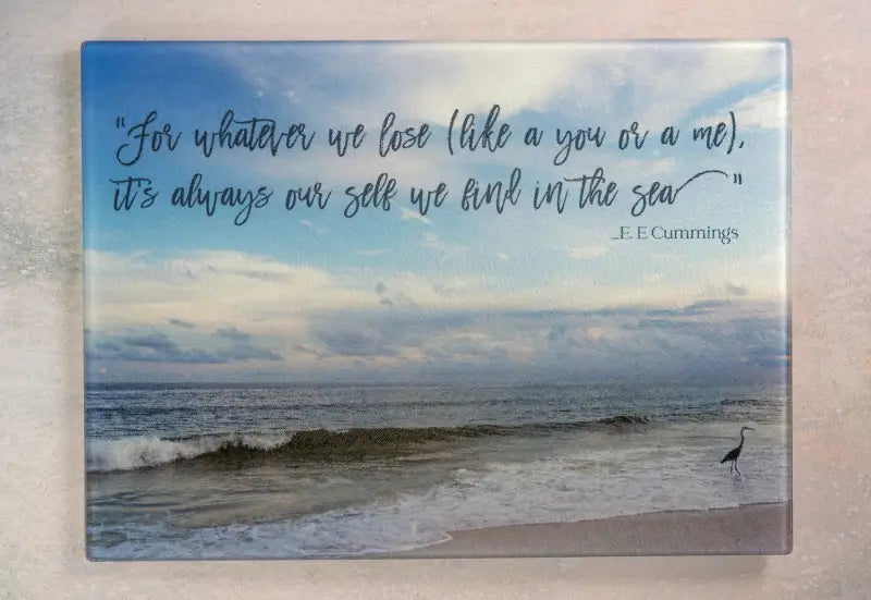Glass charcuterie board with coastal heron design and inspirational quote