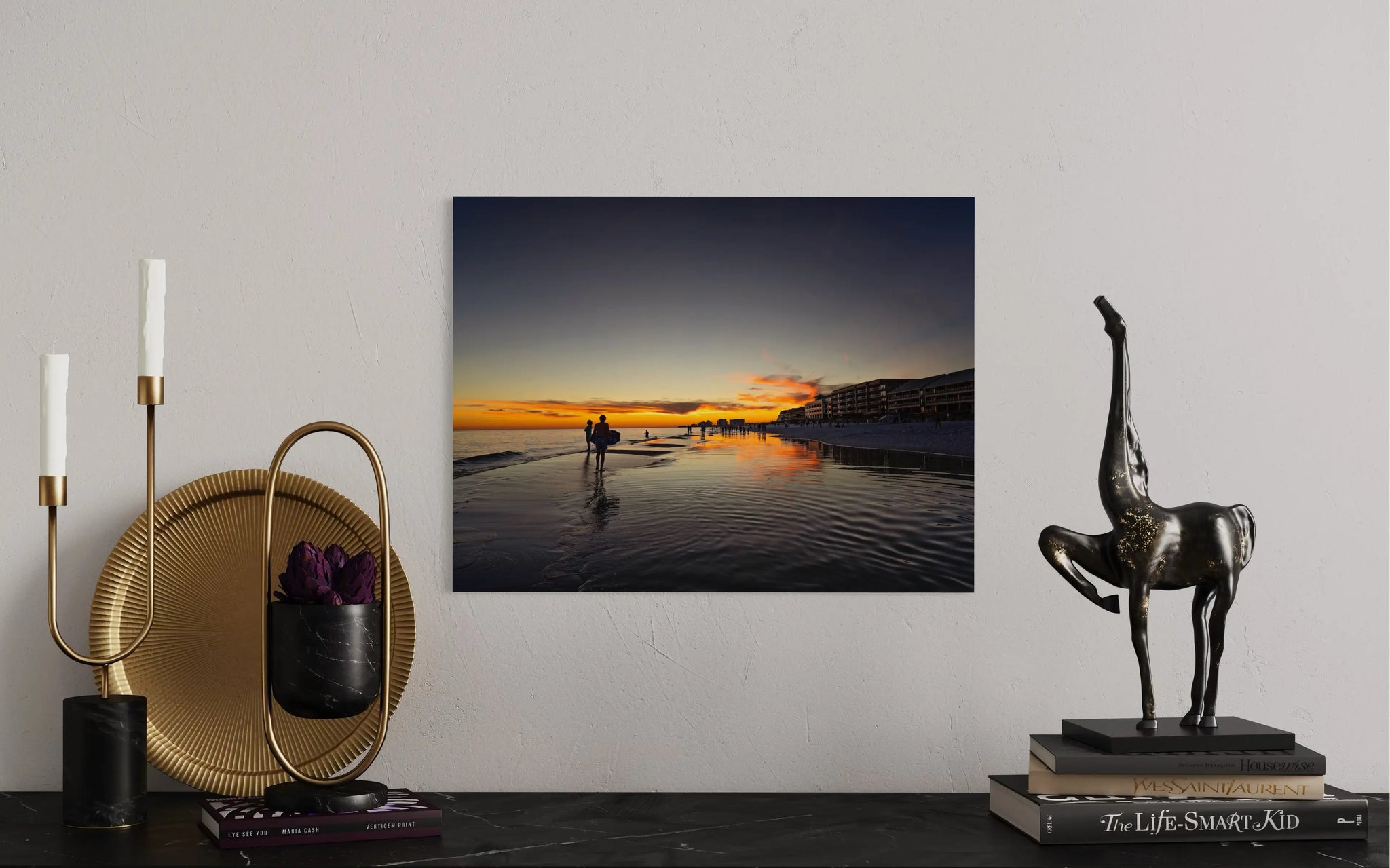 Ocean wall art glass print of Miramar Beach sunset with beachgoers and reflections, coastal decor