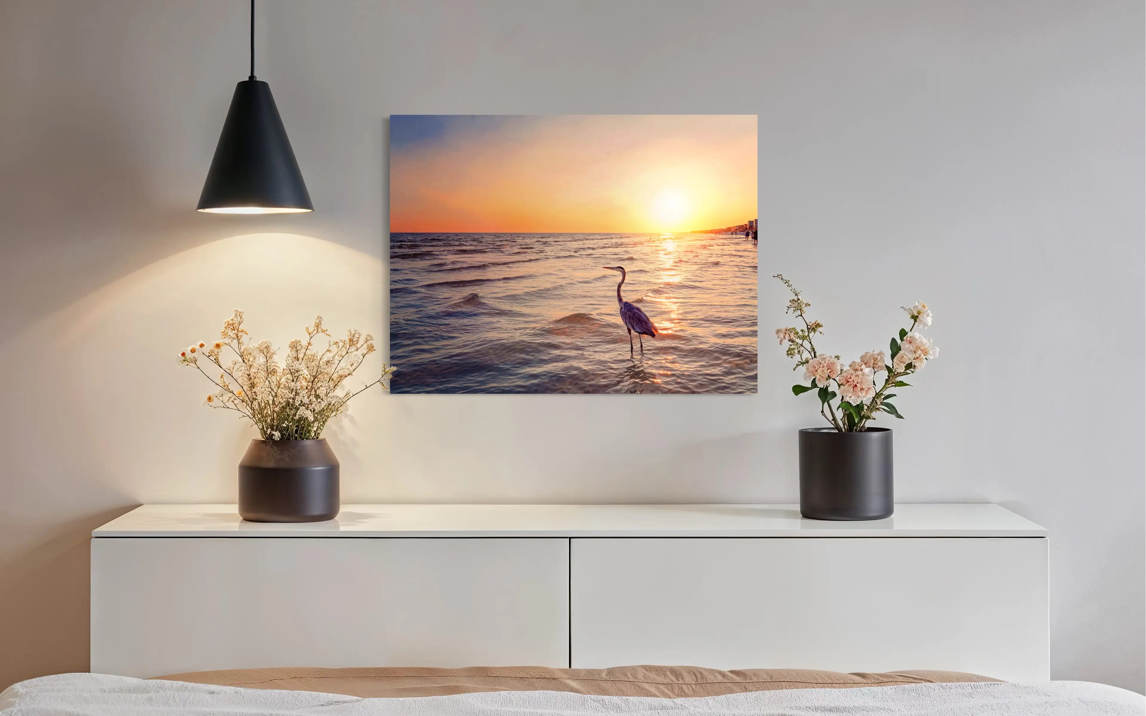 Sunset coastal glass print of heron standing in the waters of Okaloosa Island in living room.