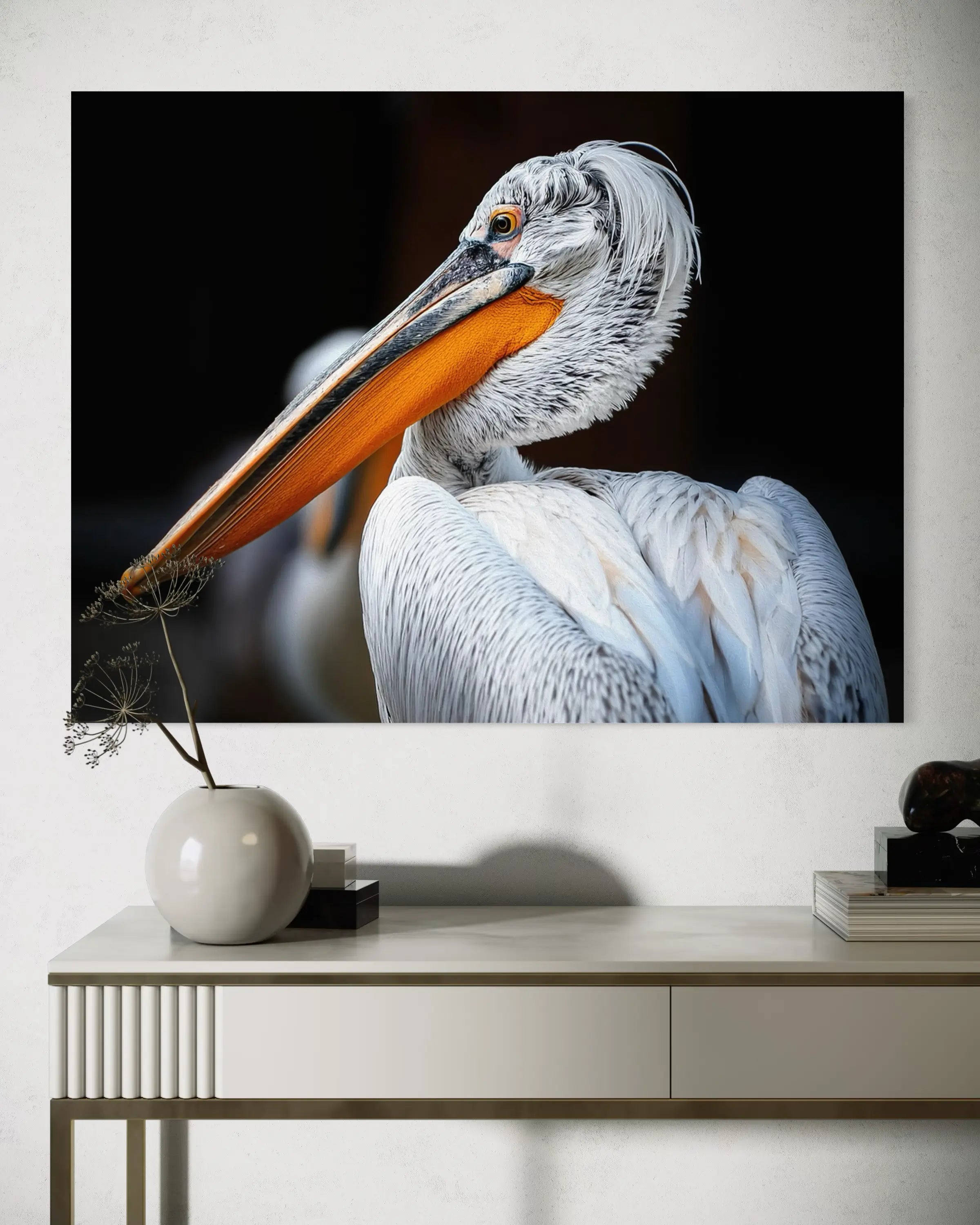Close-up of a Dalmatian pelican with vibrant orange beak and speckled feathers, set against a black background, over side table