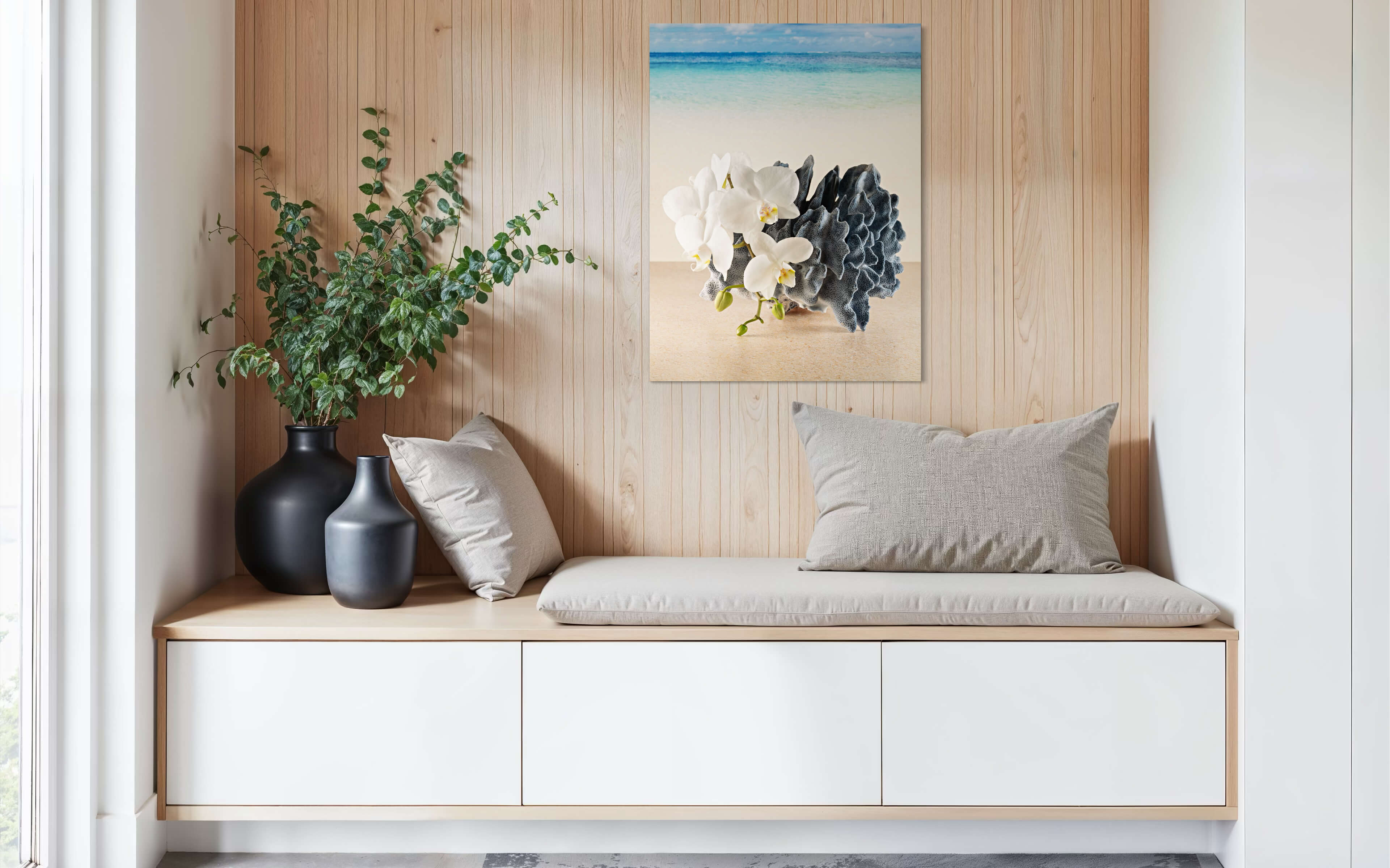 Coastal glass print with blue coral and white orchids against a serene beach scene-sitting area