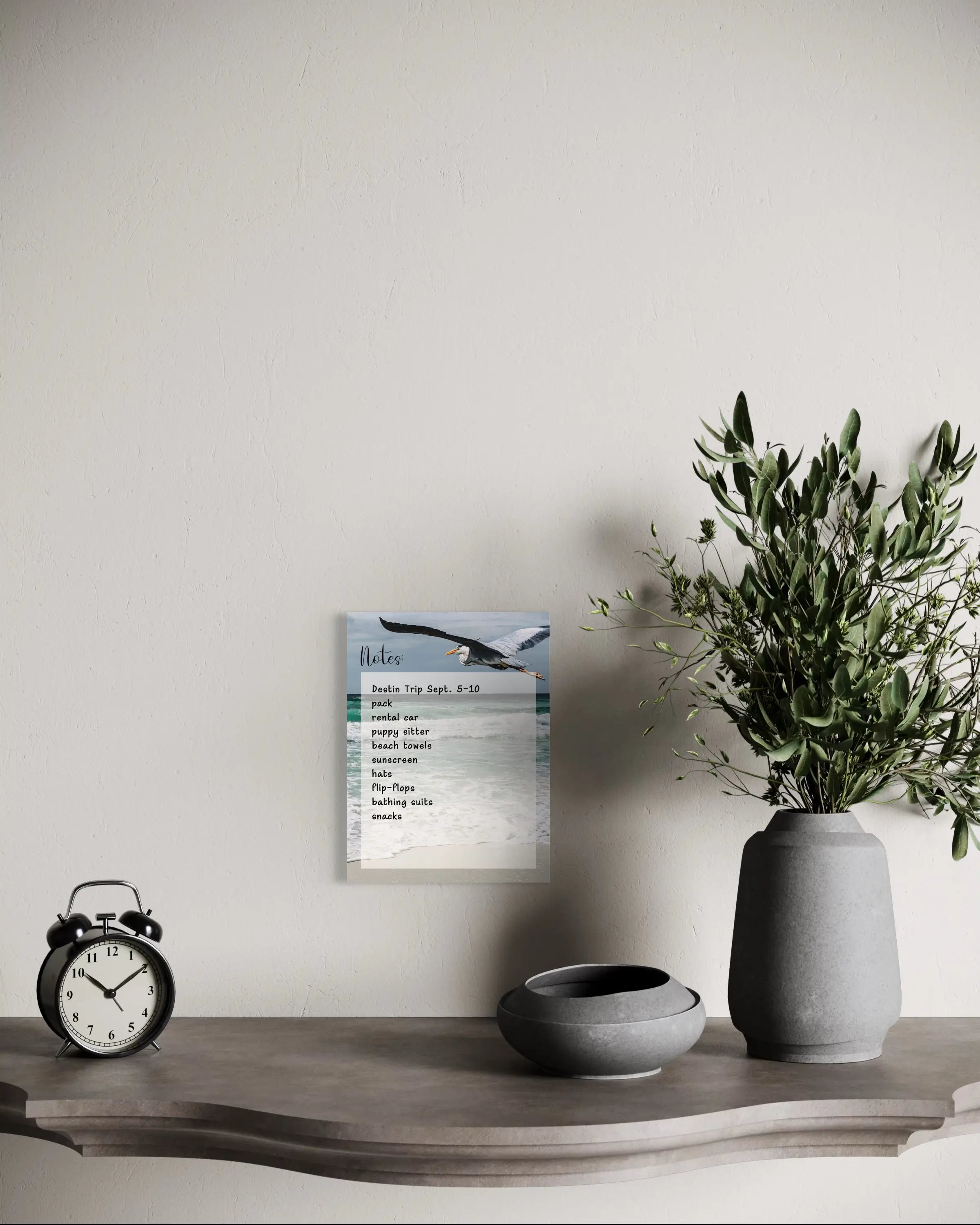 A reusable glass notes board featuring a Great Blue Heron in flight over ocean waves, with a blank dry-erase surface for notes and to-do lists.