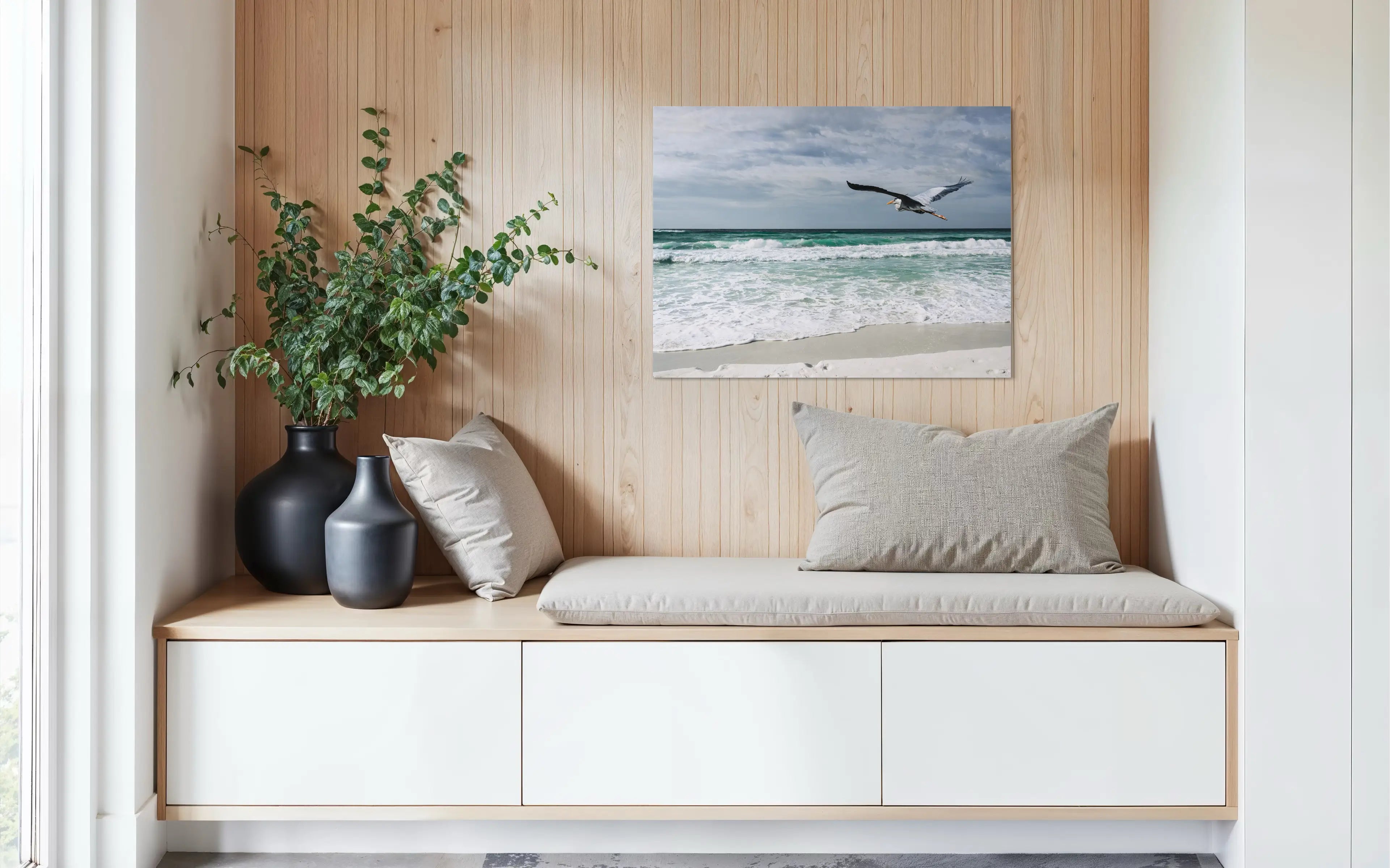 Great blue heron in flight over emerald Gulf waves at Henderson Beach, coastal glass print wall art for cozy sitting nooks.