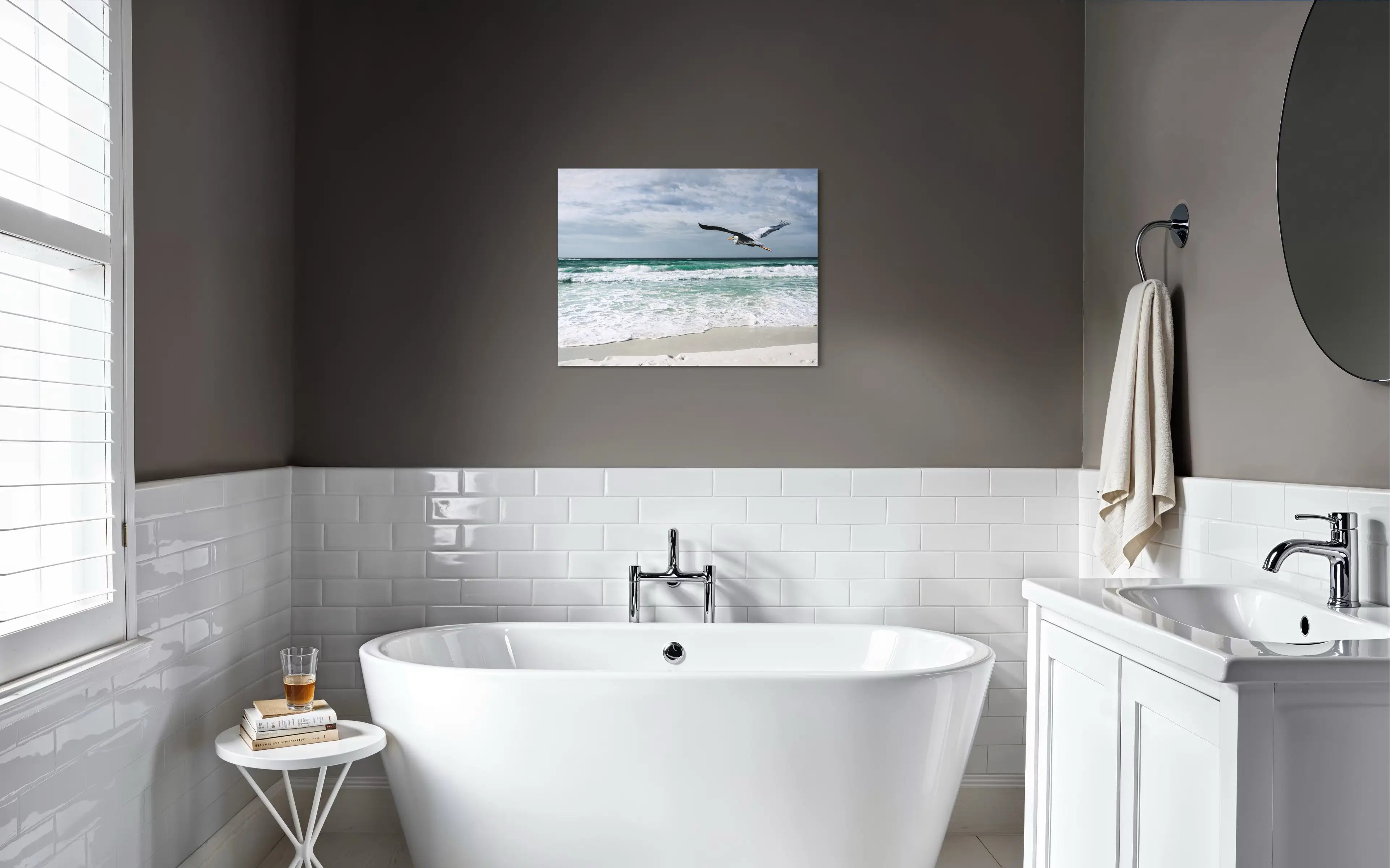 Great blue heron in flight over emerald Gulf waves at Henderson Beach, coastal glass print wall art for coastal bathroom.