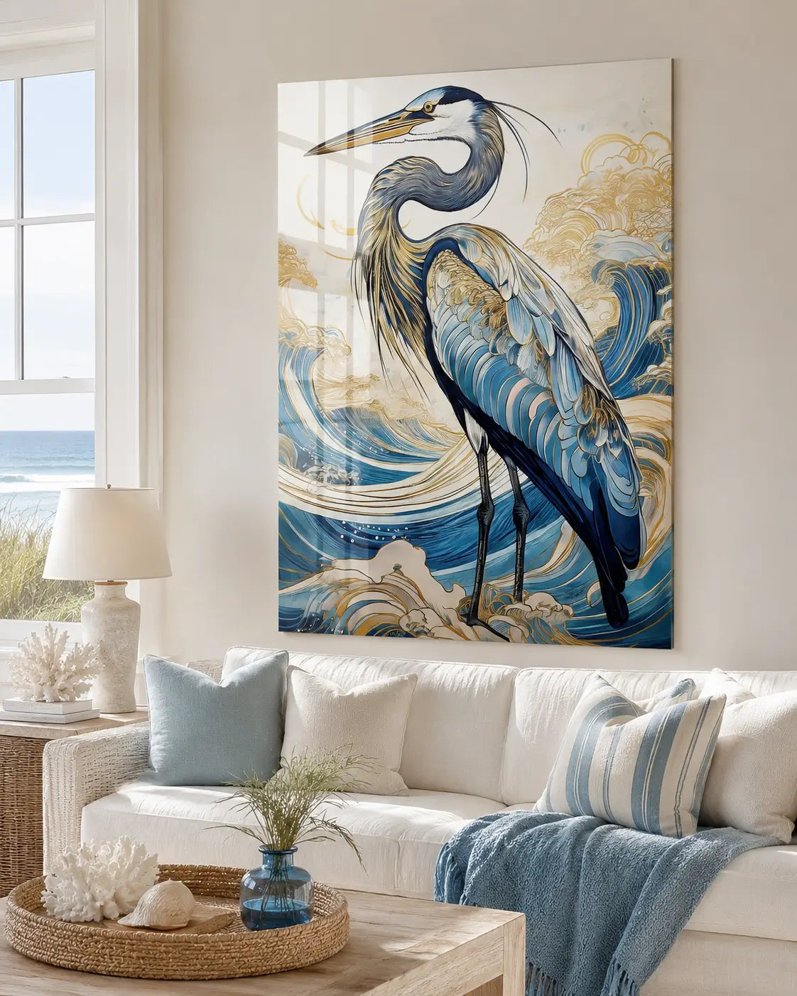 Coastal living room with a large glass print of a heron on the wall, featuring ocean waves.