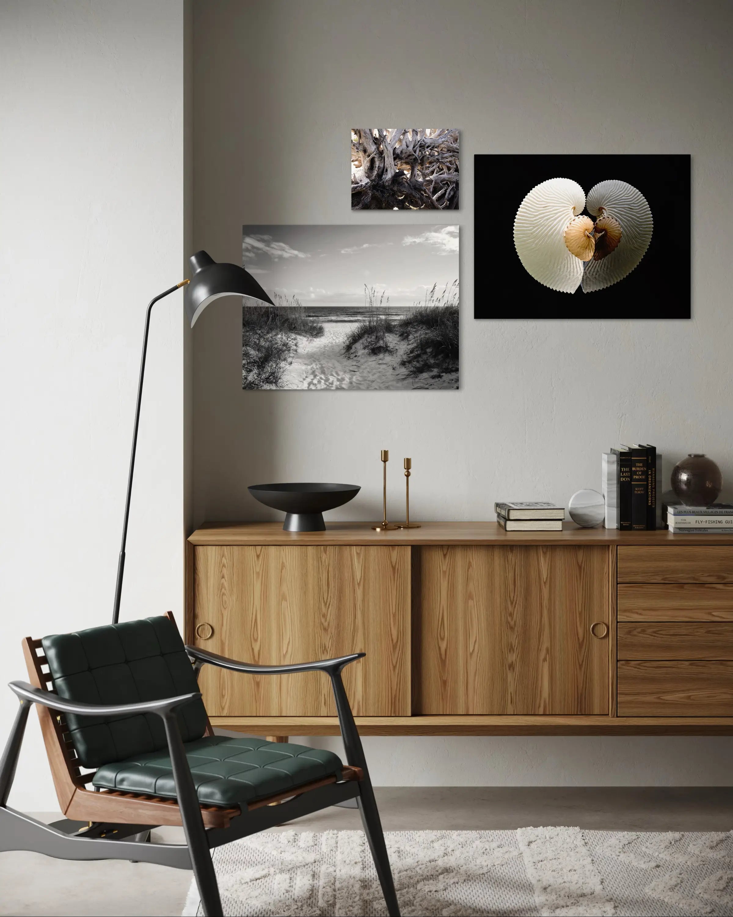 Beach house art display – driftwood wall decor with coral and seashell glass prints above sideboard.