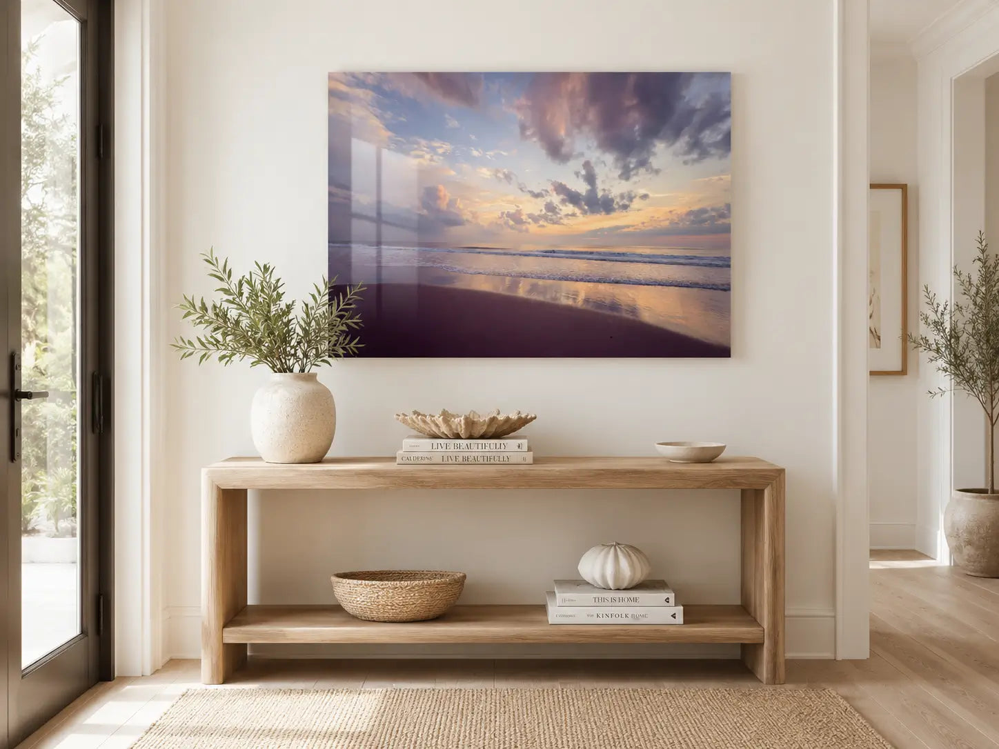 Light and airy coastal entryway with serene Corolla sunrise glass print