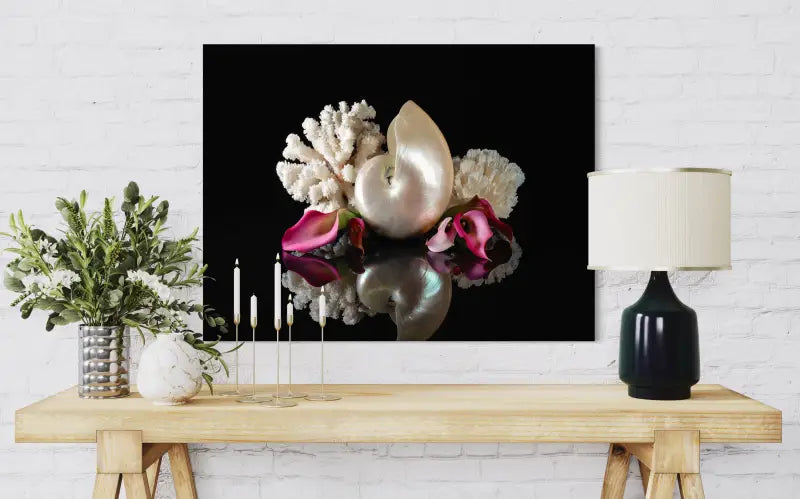 Nautilus shell and lilies on black reflective glass, Echoes art, coastal glass print  for ocean wall decor.