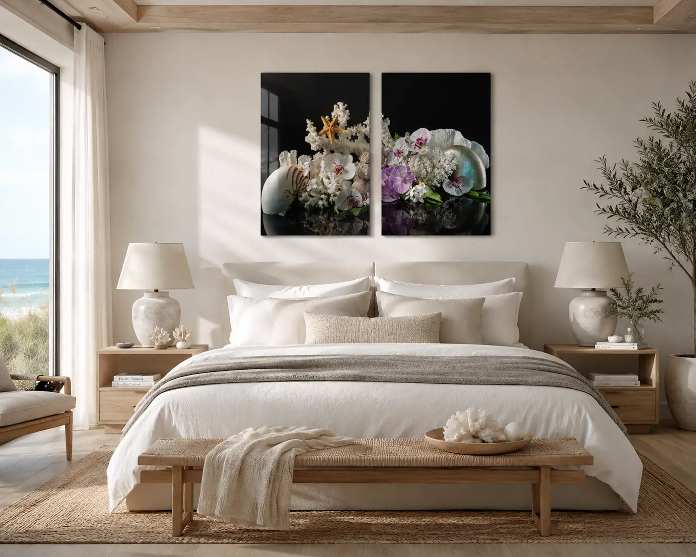 Nautilus and orchid diptych glass wall art displayed above a neutral bed in a bright modern coastal bedroom.