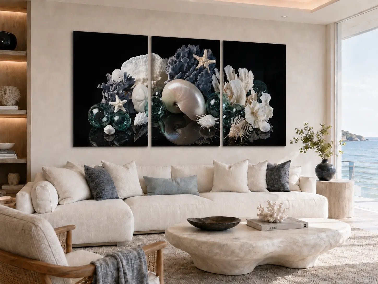 Pearl nautilus triptych glass wall art with antique Japanese glass floats displayed above a cream sectional in a luxury modern coastal living room.