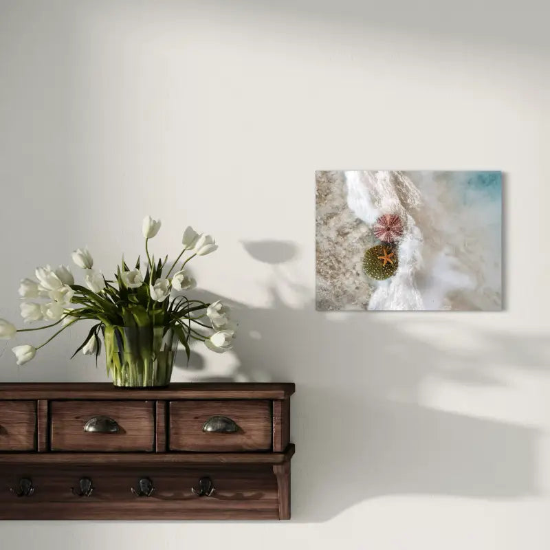 Seashell coastal glass print with starfish and sea urchins in foamy waves, coastal home wall deco
