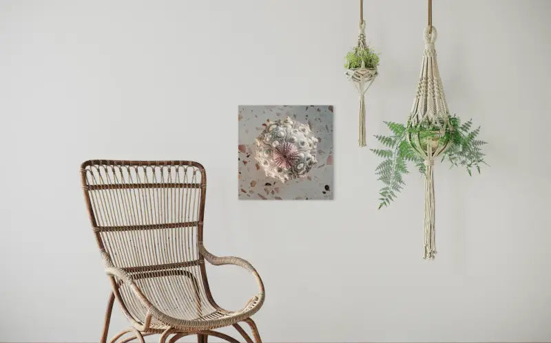 Top-down view of stacked pink sea urchins on terrazzo background, seashell glass print, seating area