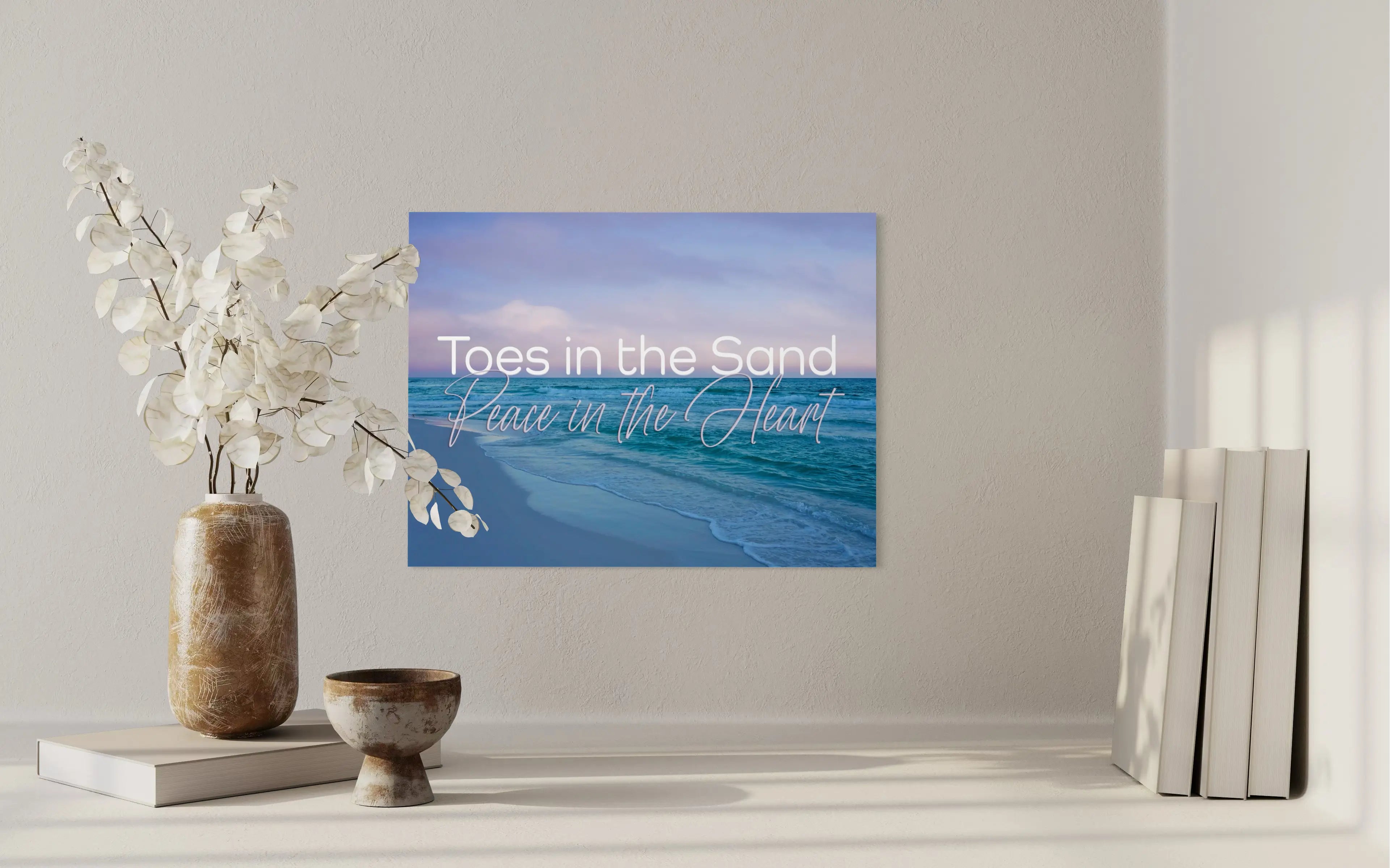 Peace in the Heart beach wall art coastal glass print displayed above a minimalist shelf, elegant neutral coastal decorating style.