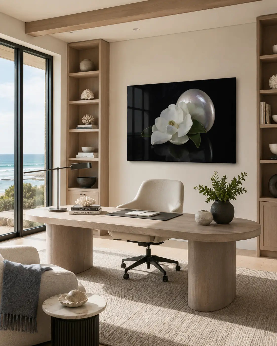 Modern coastal home office with a desk, chair, and nautilus, magnolia glass print