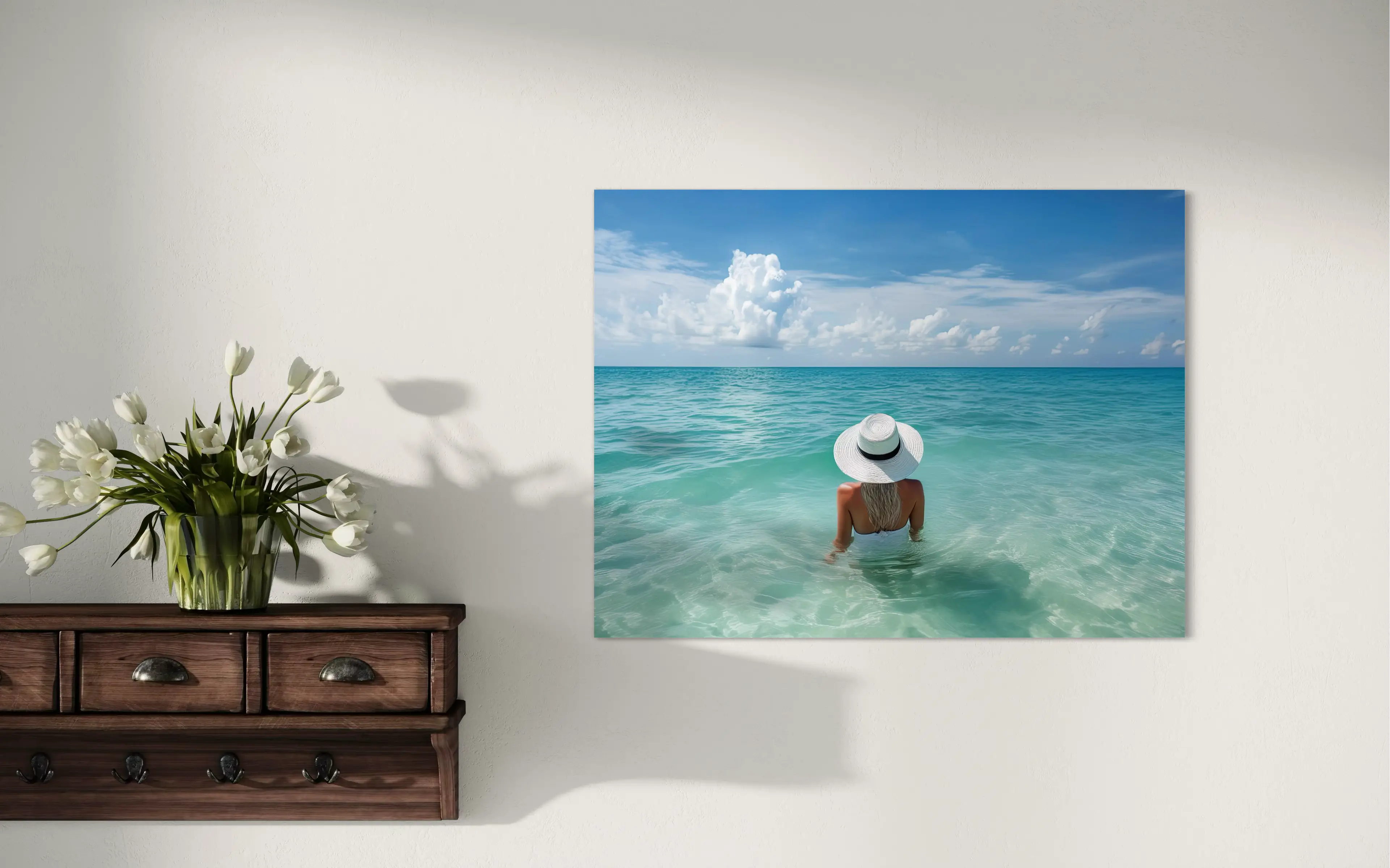 Woman in white hat sitting in Gulf turquoise ocean coastal glass print, coastal wall decor