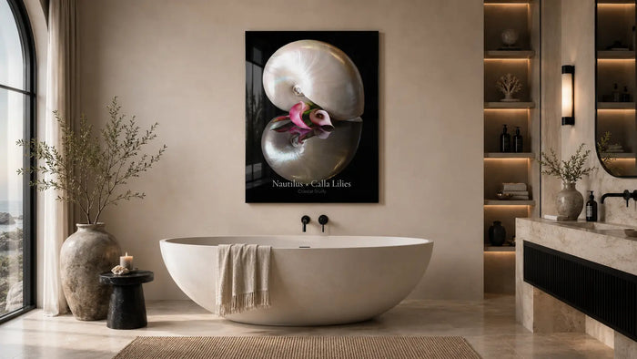 Luxury spa bathroom with Nautilus x Calla Lilies coastal wall art above a freestanding tub, warm stone finishes, black accents, and softly lit built-in shelving.