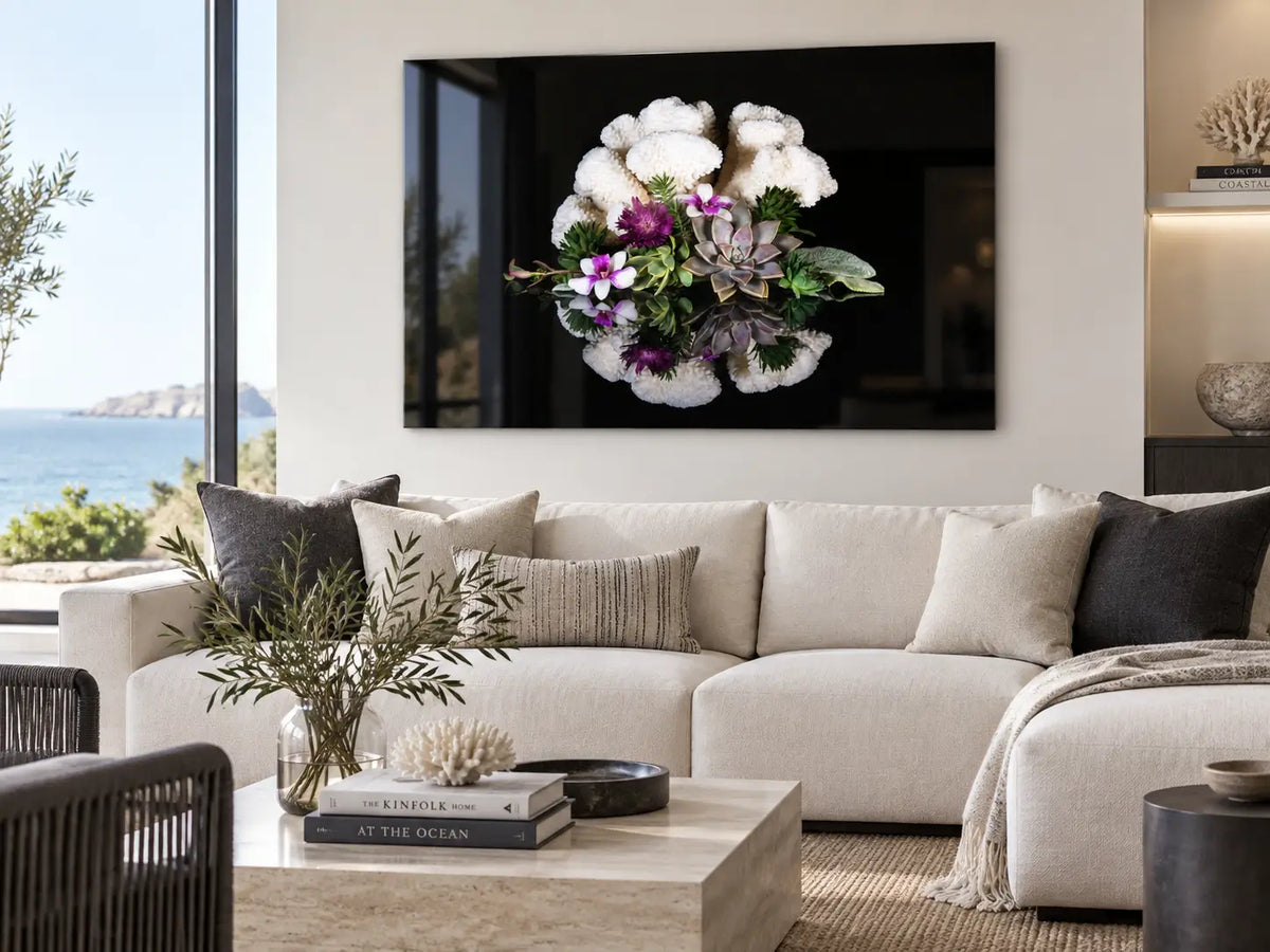 Modern coastal living room with charcoal accents featuring a horizontal cauliflower coral and succulent glass print
