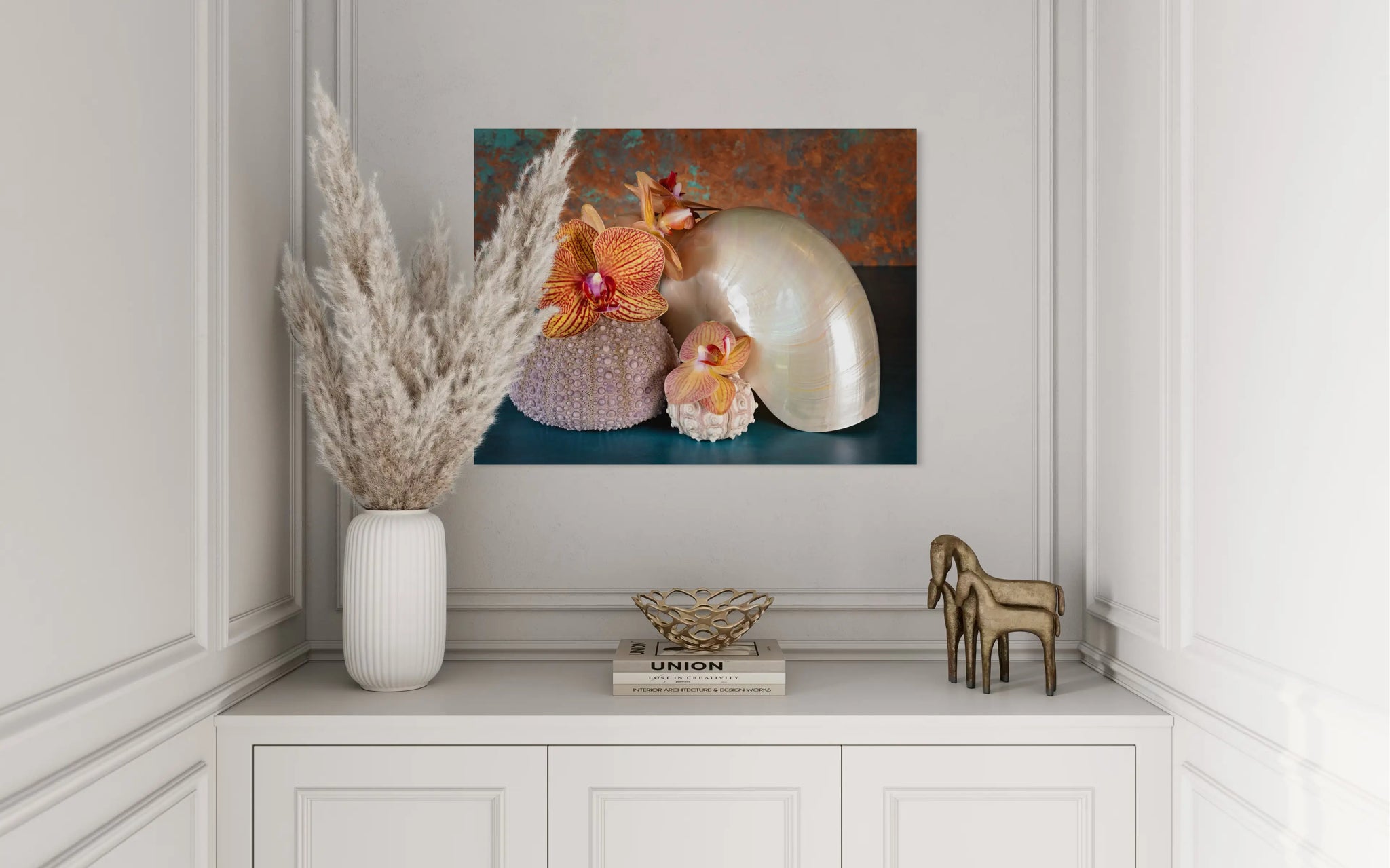 Glass print of orchids, pearl nautilus and sea urchins in a modern decor setting.
