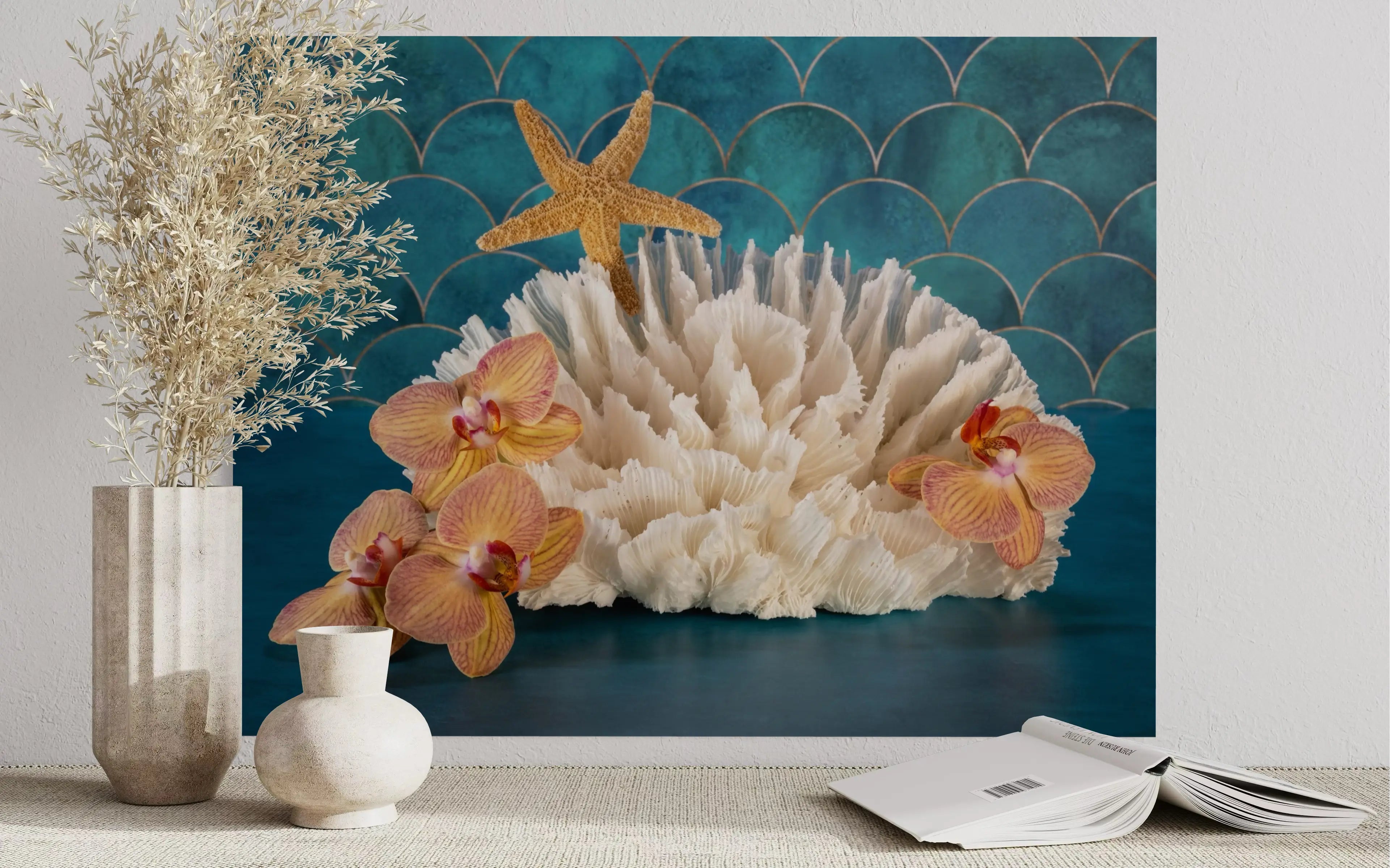 Vibrant tropical glass print of orchids, poca coral and a starfish on a colorful blue background that evokes the sea.