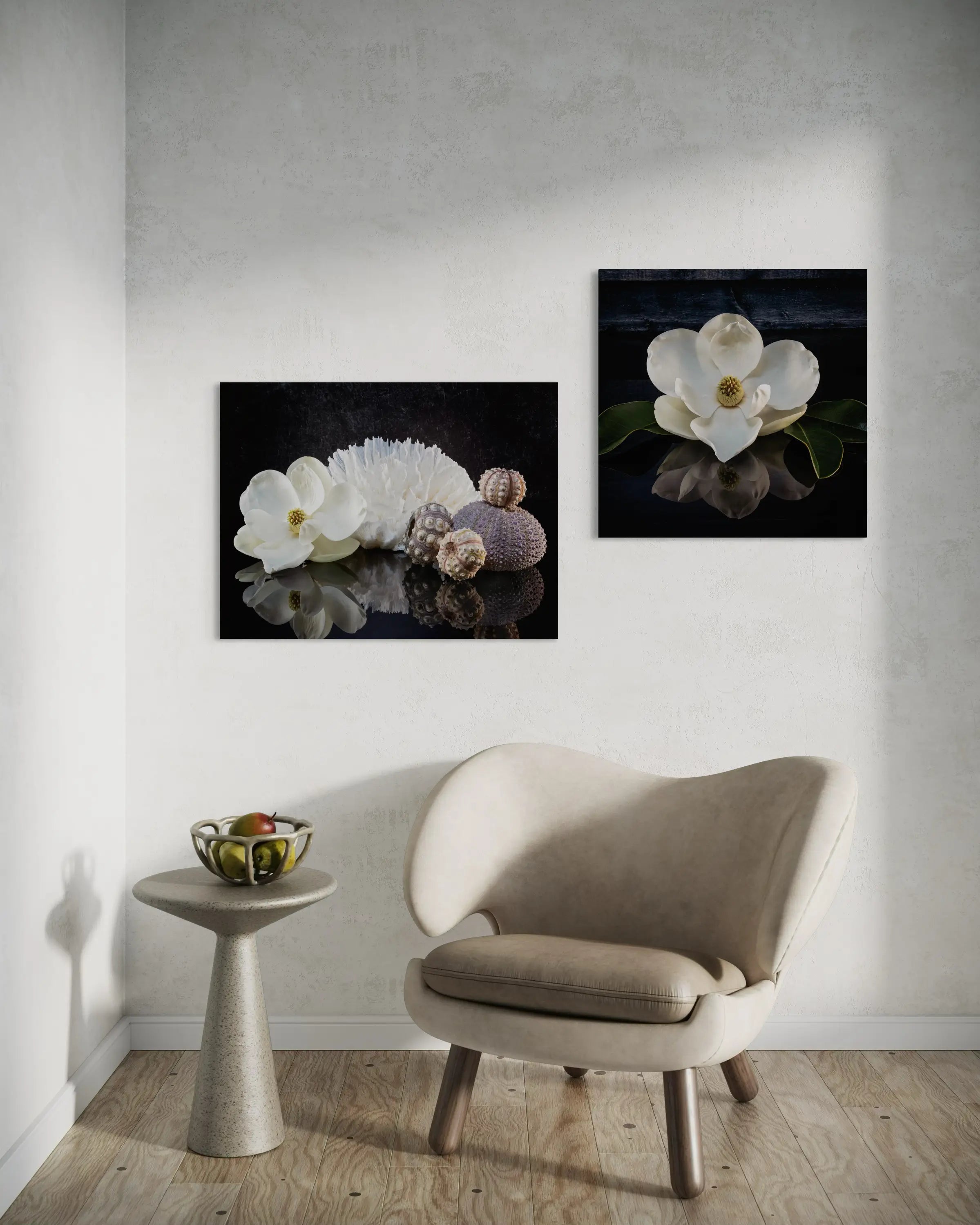 Glass print of a magnolia blossom, poca coral and sea urchins on a reflective black background, shown with matching print.