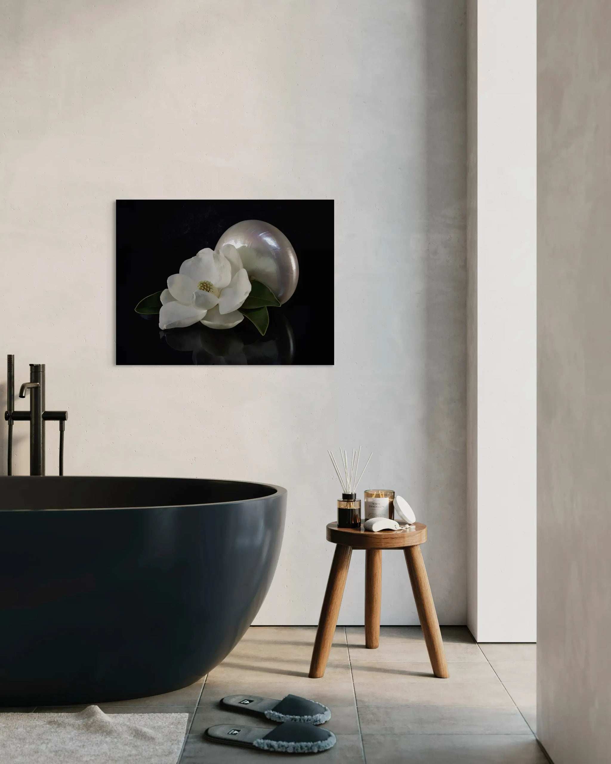 Eco-friendly glass print with magnolia blossom and pearl nautilus on reflective black background, perfect for coastal bathroom decor.
