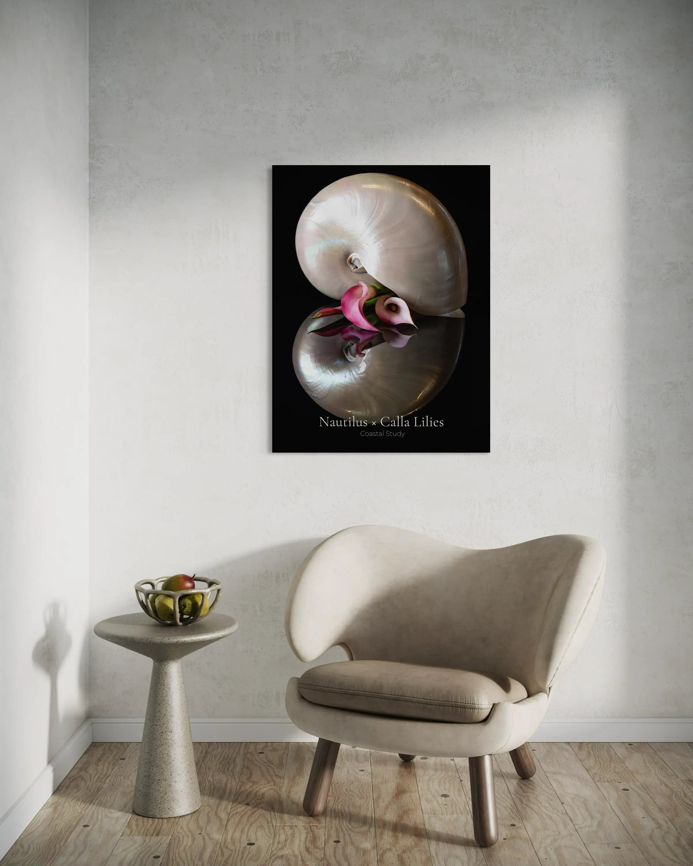 Nautilus shell wall art with calla lily displayed in a coastal sitting area above a chair