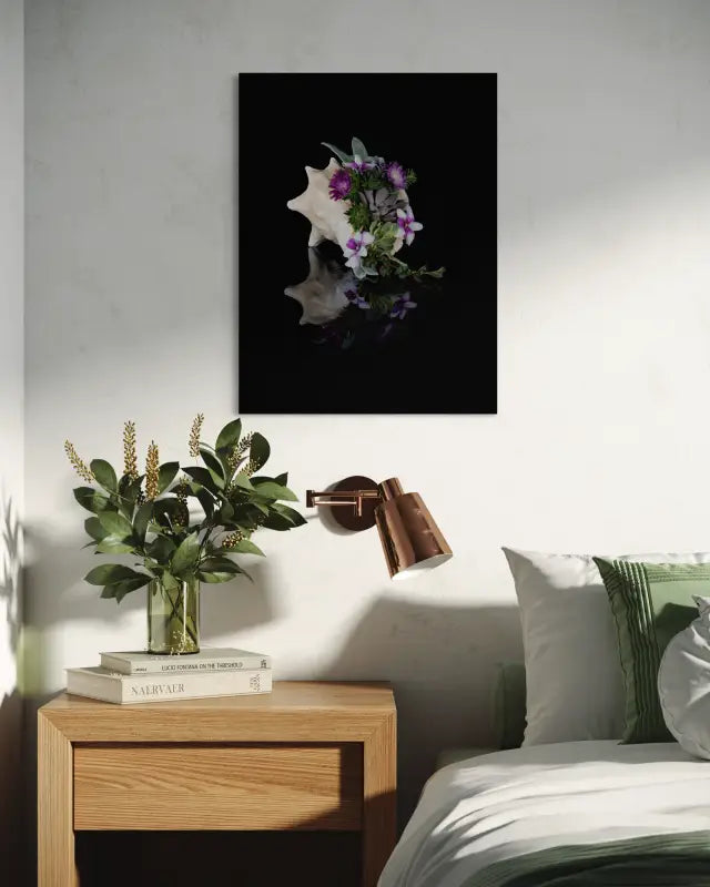 Conch shell with succulents and purple flowers on black glass print, coastal wall art