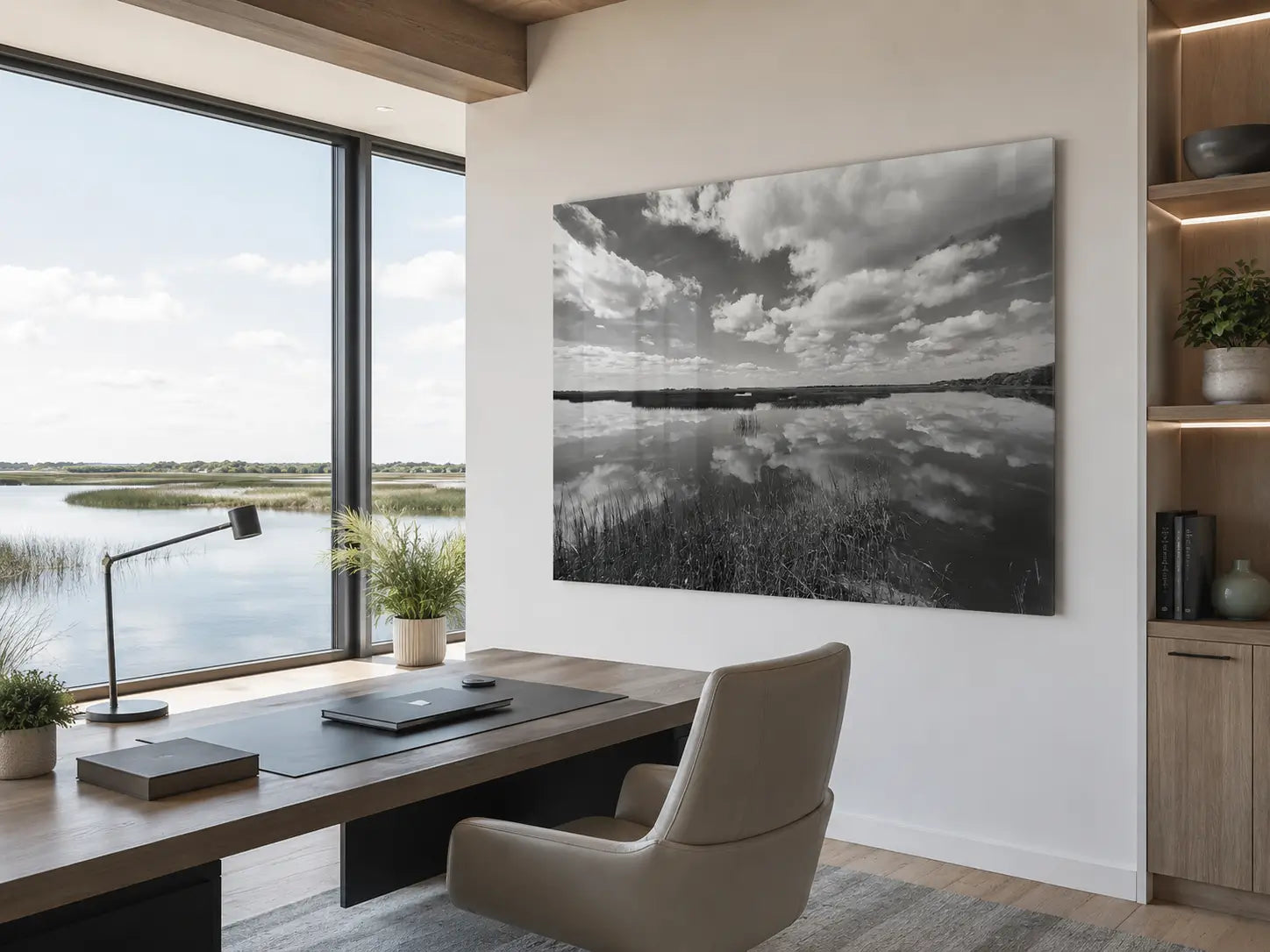 Black-and-white Cumberland Island marsh glass wall art displayed in a modern coastal office overlooking tidal wetlands.
