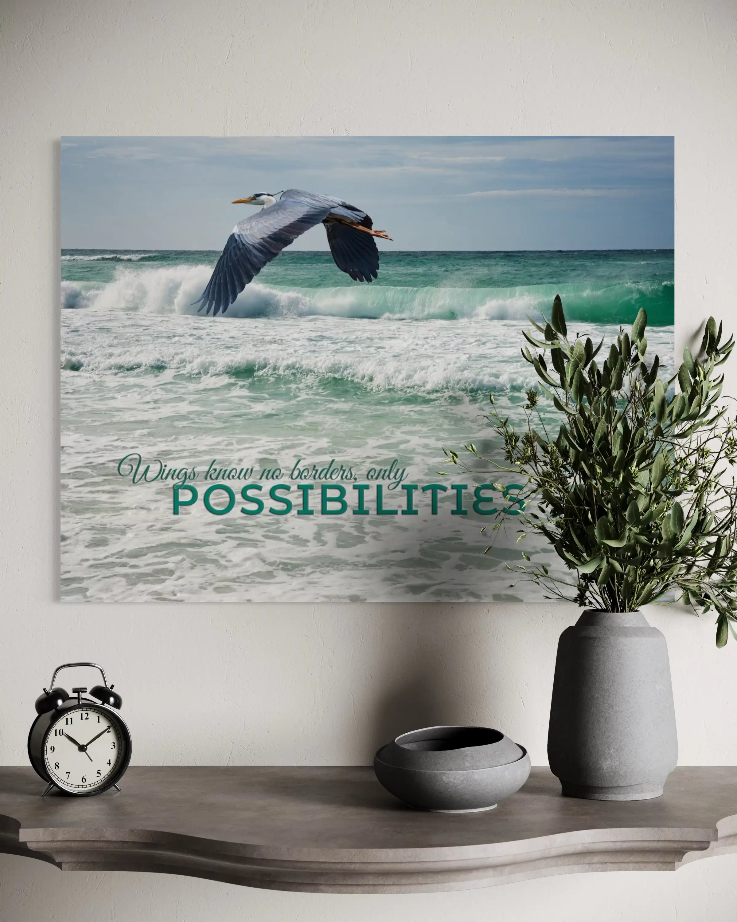 Heron in Flight Coastal Glass Print – inspirational coastal wall art styled above a rustic grey wood shelf.