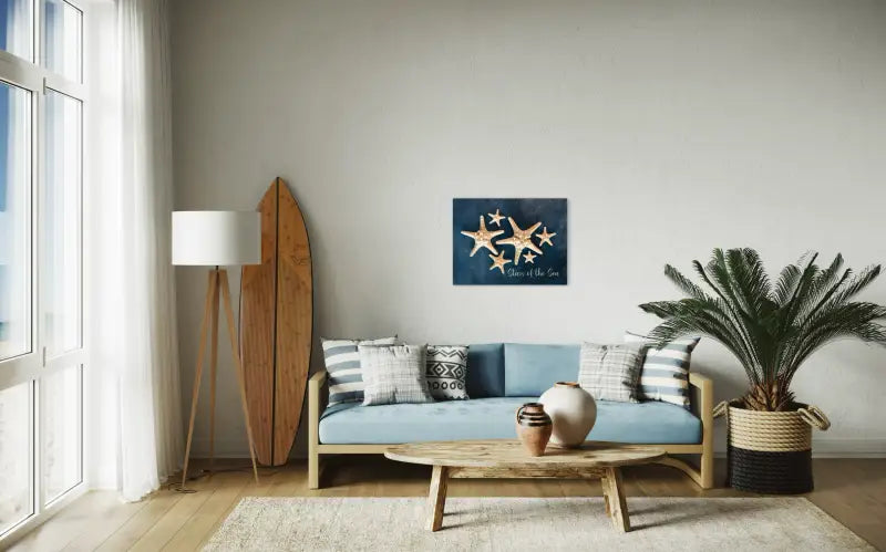 Coastal glass print with White knobby starfish with Stars of the Sea script on blue backdrop, coastal decor