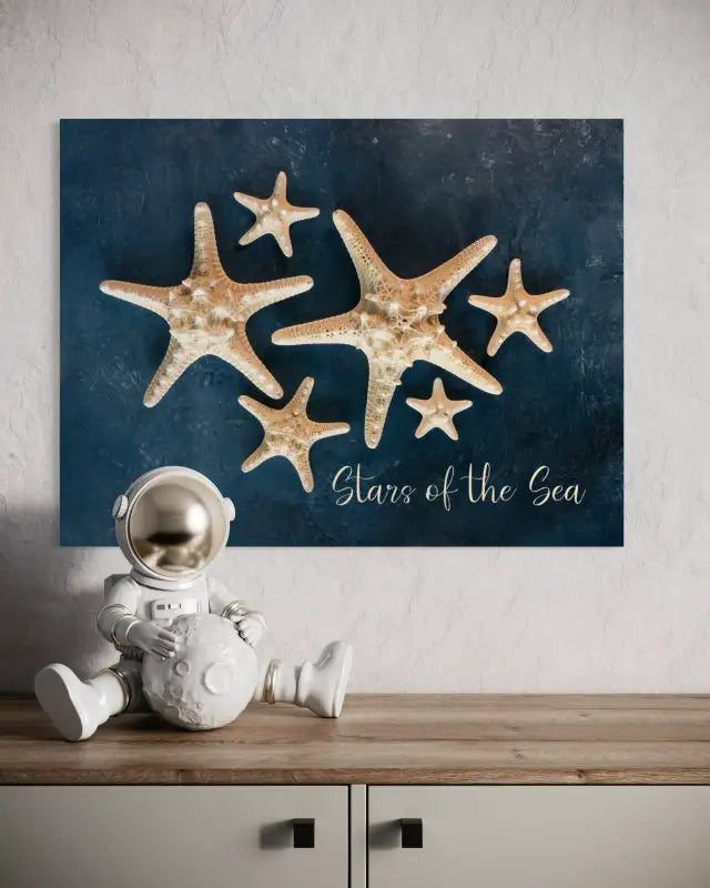 Coastal glass print with White knobby starfish with Stars of the Sea script on blue backdrop