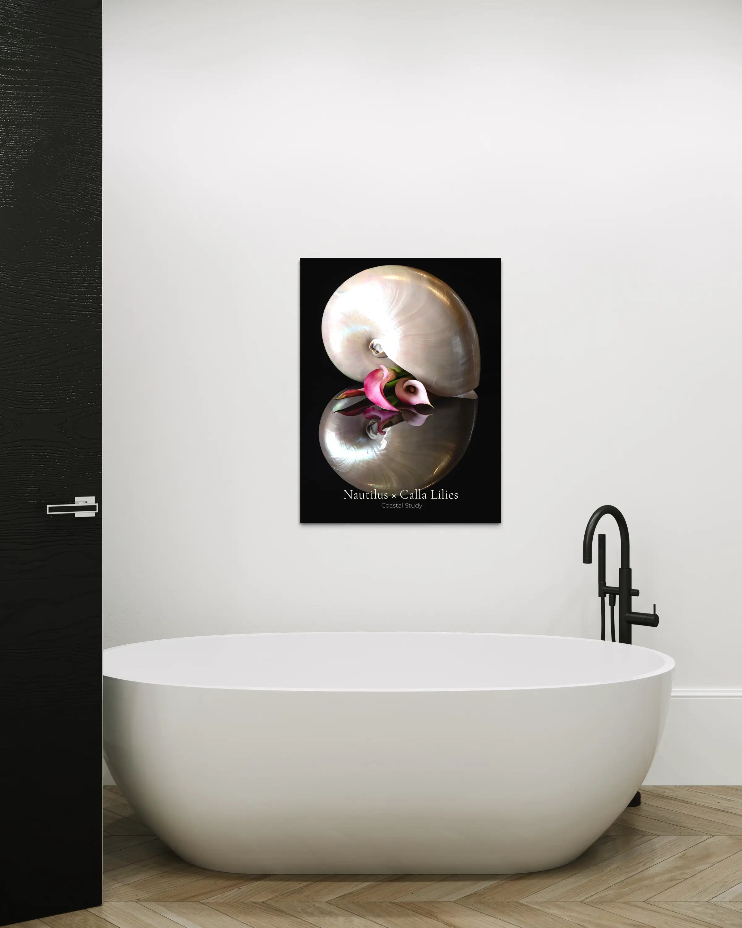 Nautilus shell wall art with calla lily displayed in a modern bathroom above a freestanding tub