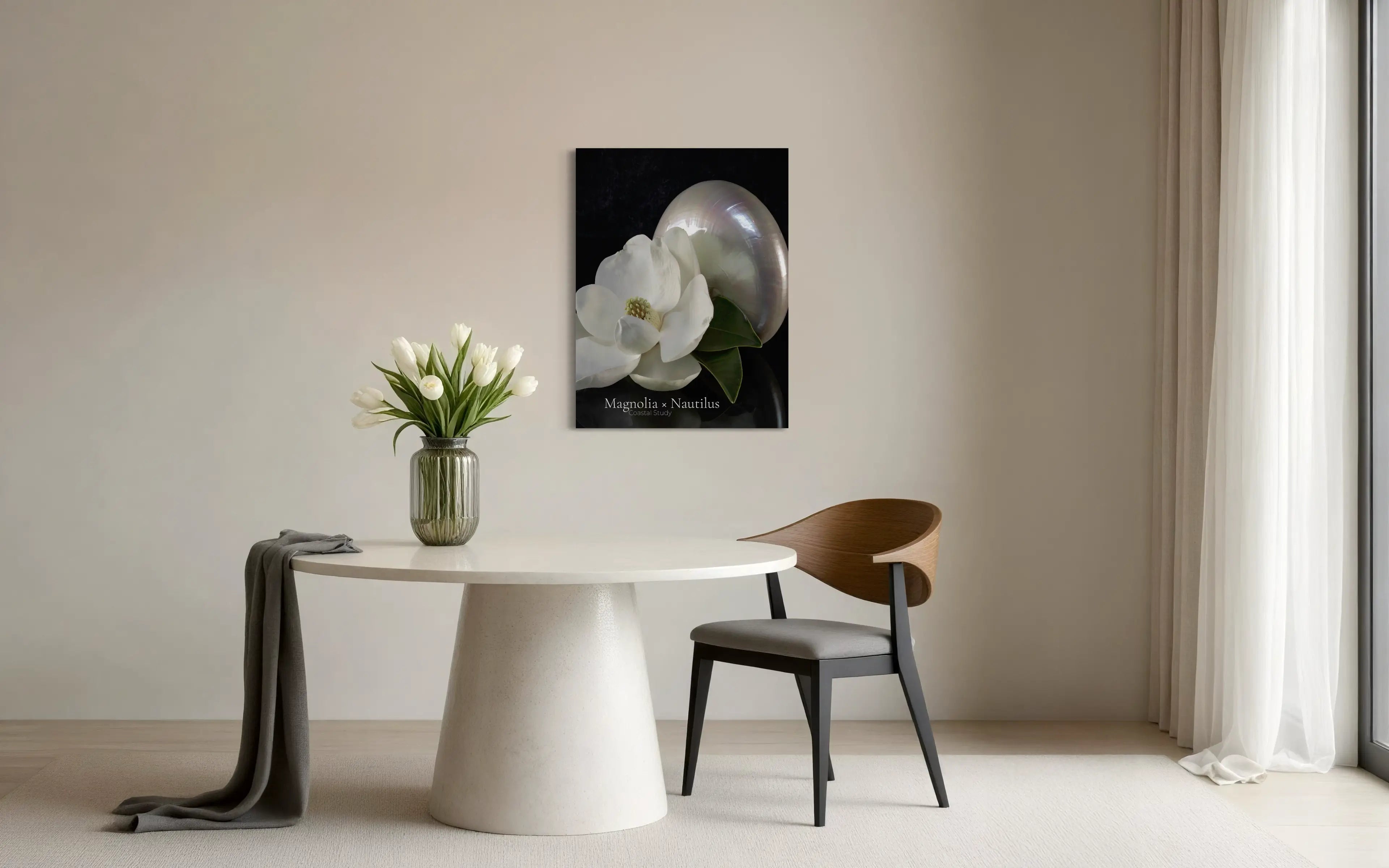 Magnolia and nautilus shell glass wall art displayed above modern dining table with neutral decor