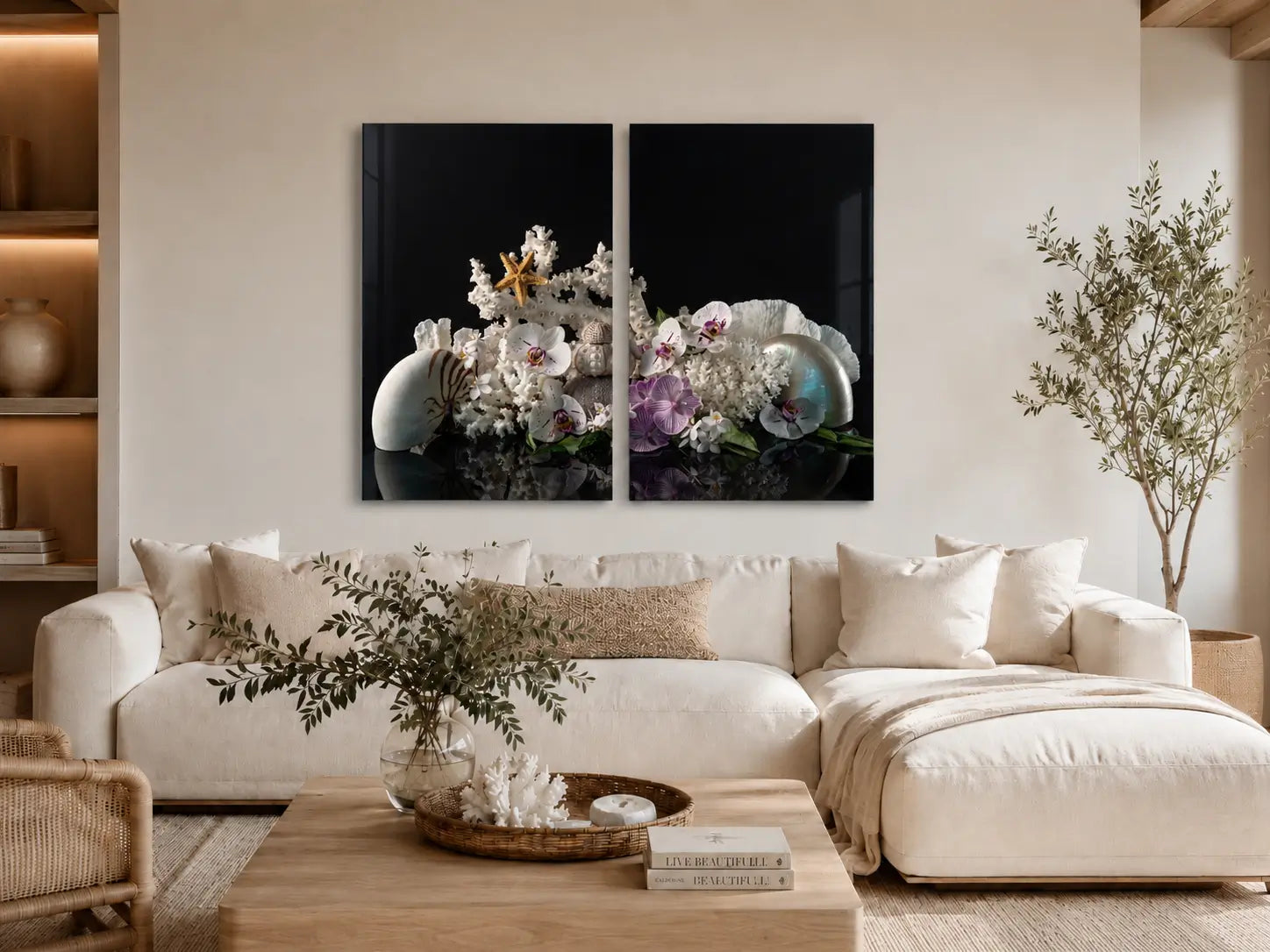 Nautilus and orchid diptych glass wall art displayed above a white sectional in a warm modern coastal living room.