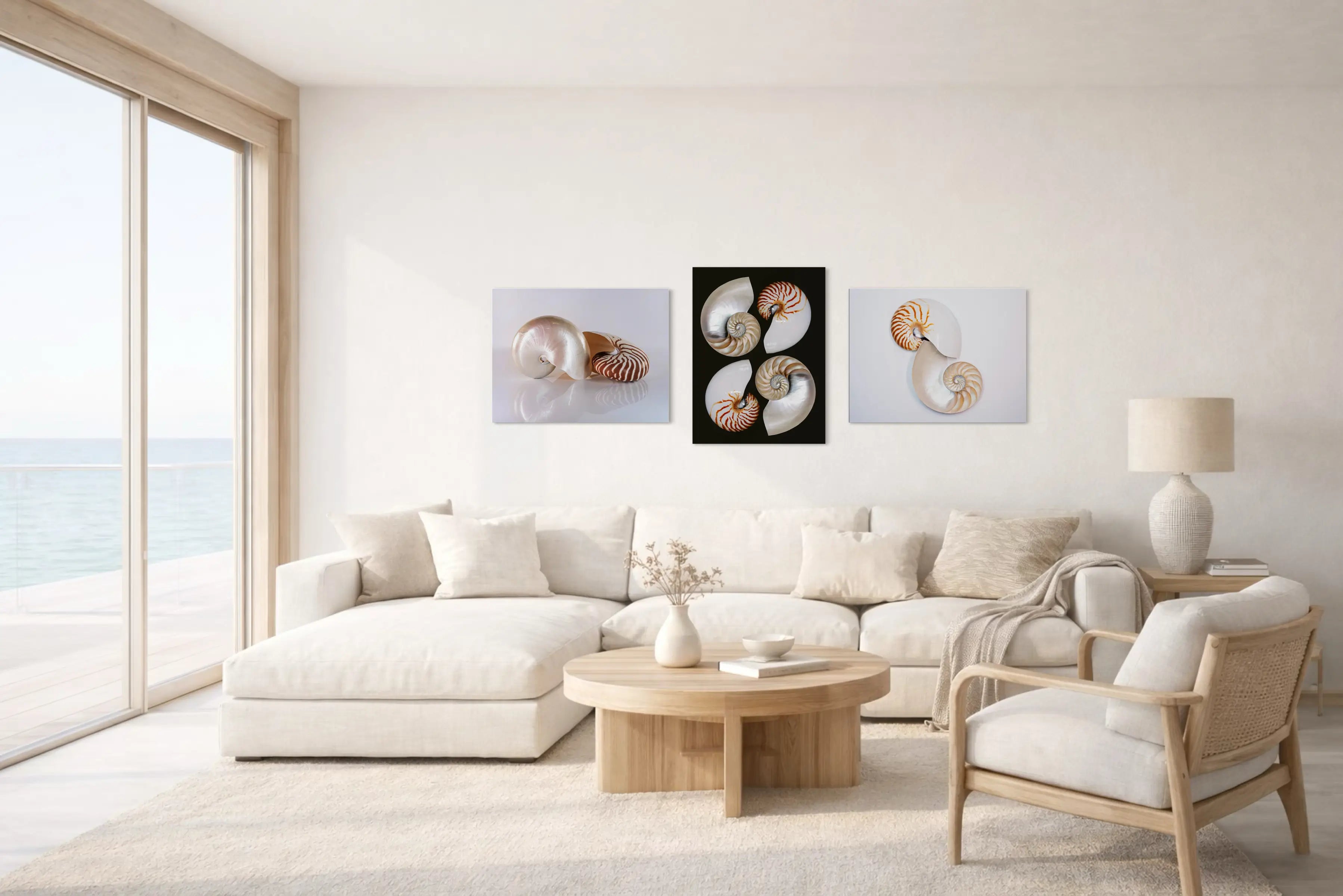 Light and airy coastal living room with seashell glass wall art above sofa