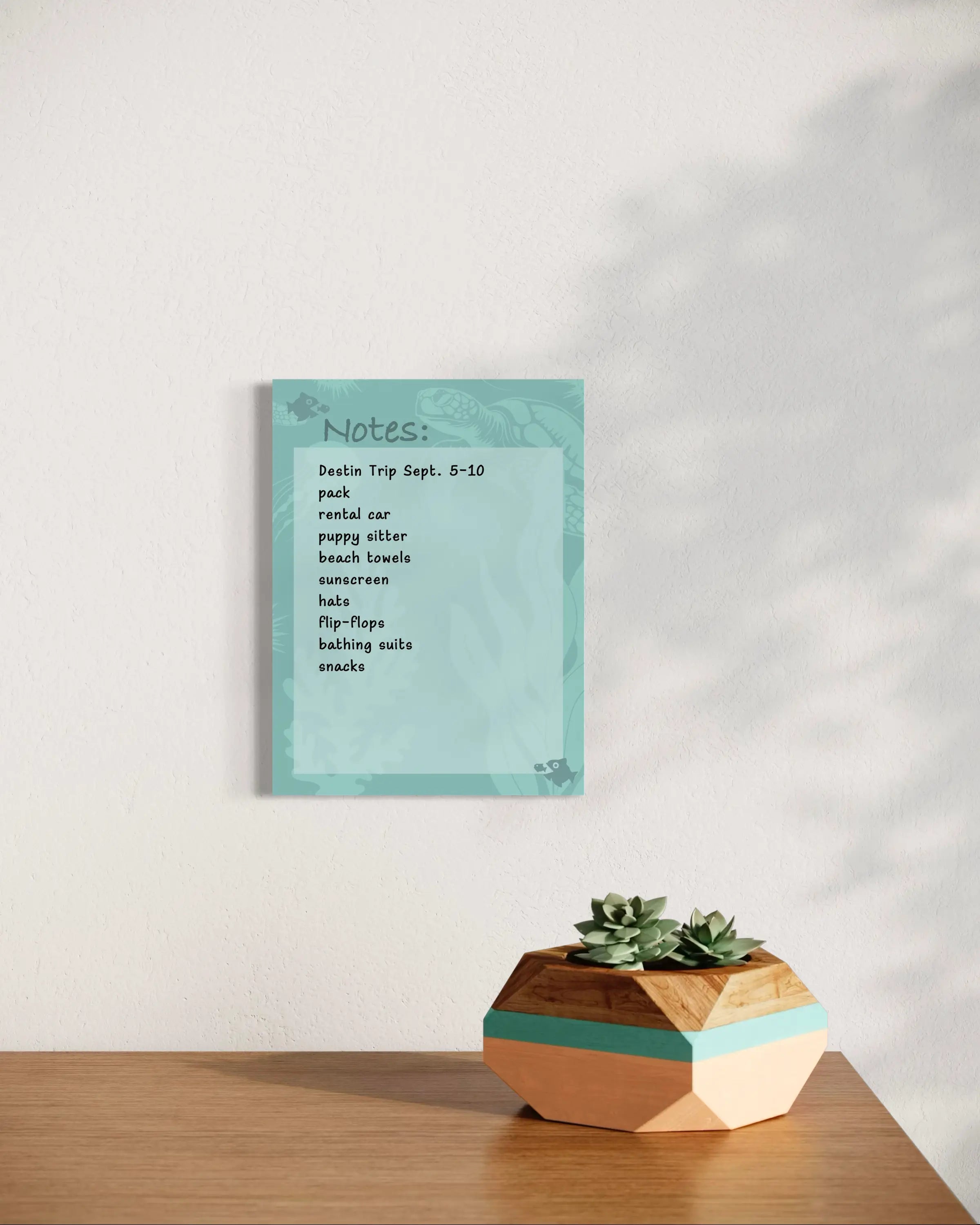 Reusable dry-erase notes board with intricate, tone-on-tone teal design featuring various sealife including a sea turtle, fish, and jellyfish, coastal decor
