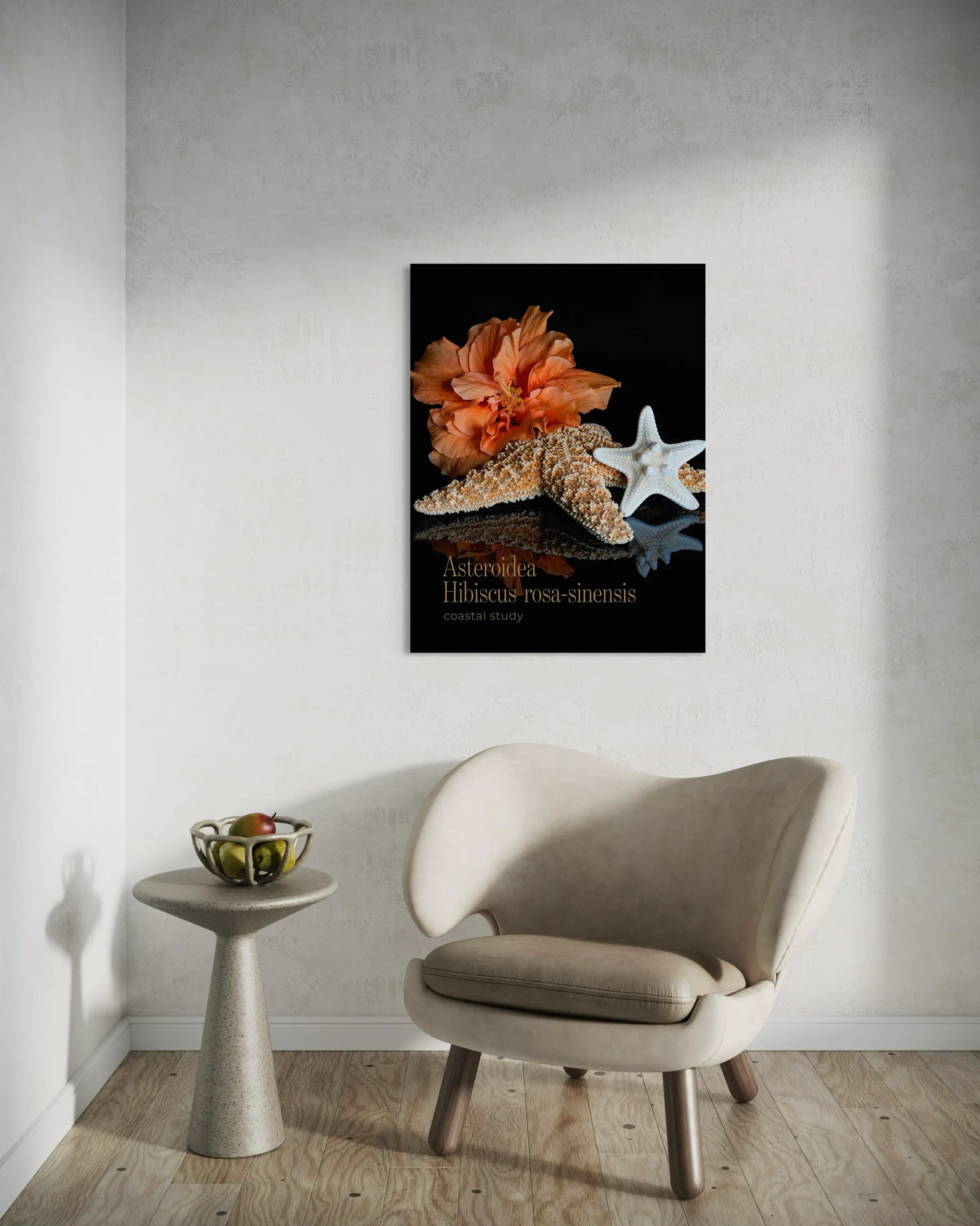 Coastal starfish hibiscus wall art displayed above a modern accent chair in a neutral living room