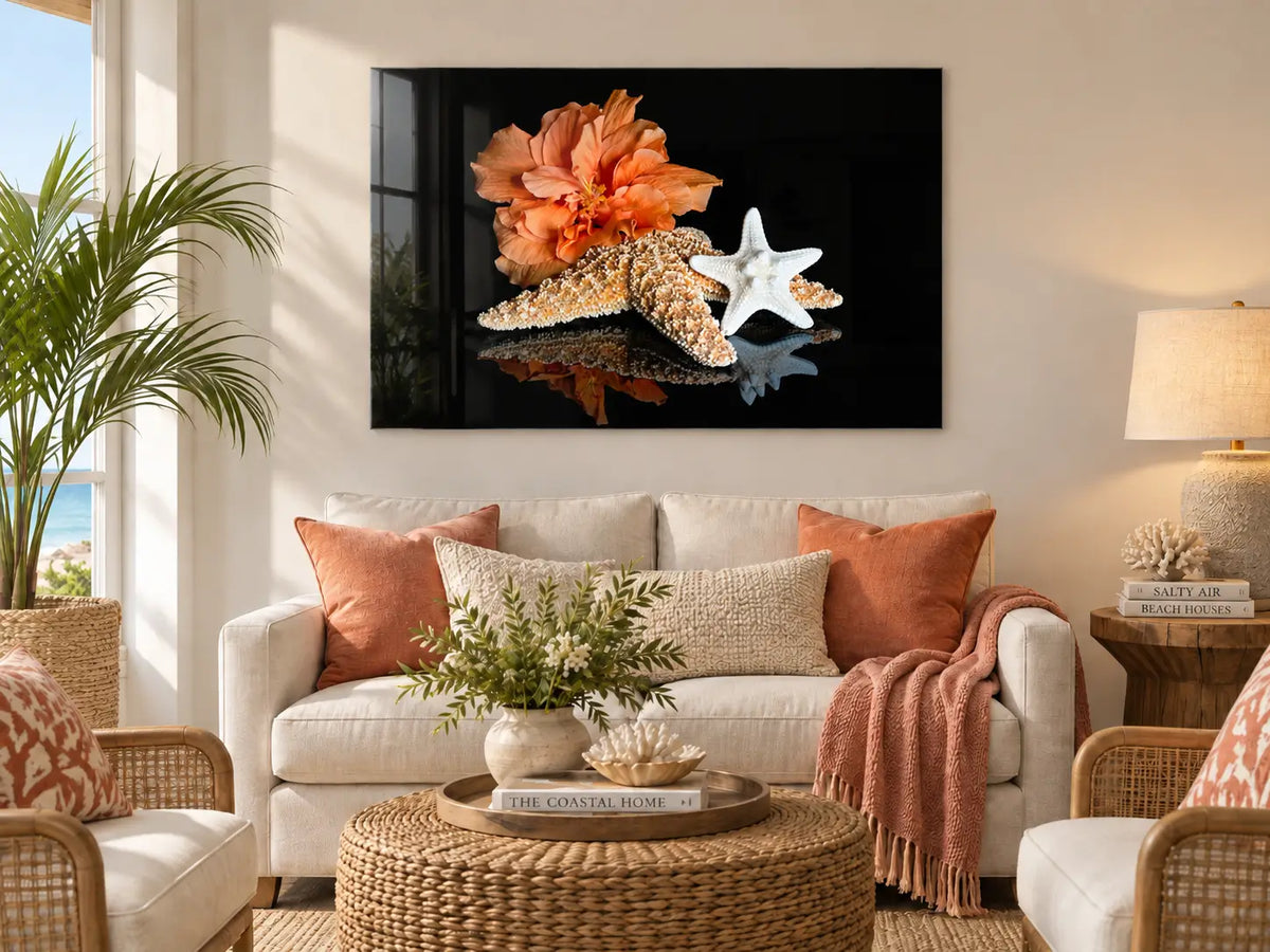 Starfish and hibiscus glass print displayed above a sofa in a warm modern coastal living room.