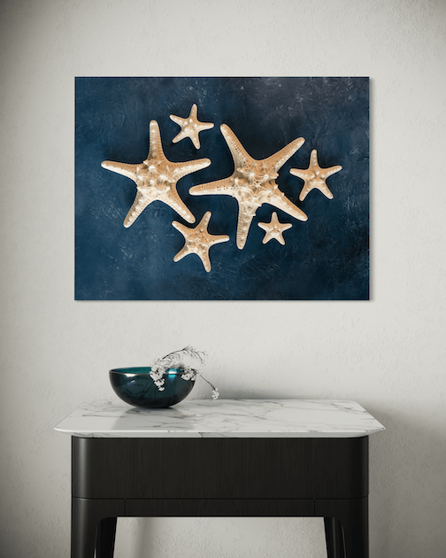 Starfish Serenity Glass Art Print with knobby starfish on blue backdrop, perfect or coastal wall decor.