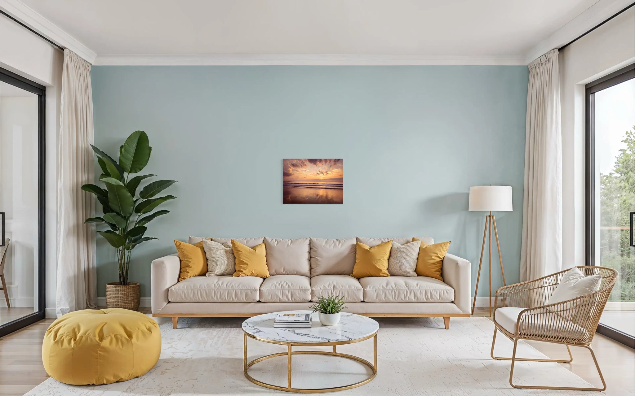 A vibrant coastal glass print featuring a sunrise on the Outer Banks, with golden light reflecting on the calm ocean waves and soft sand, coastal living room decor