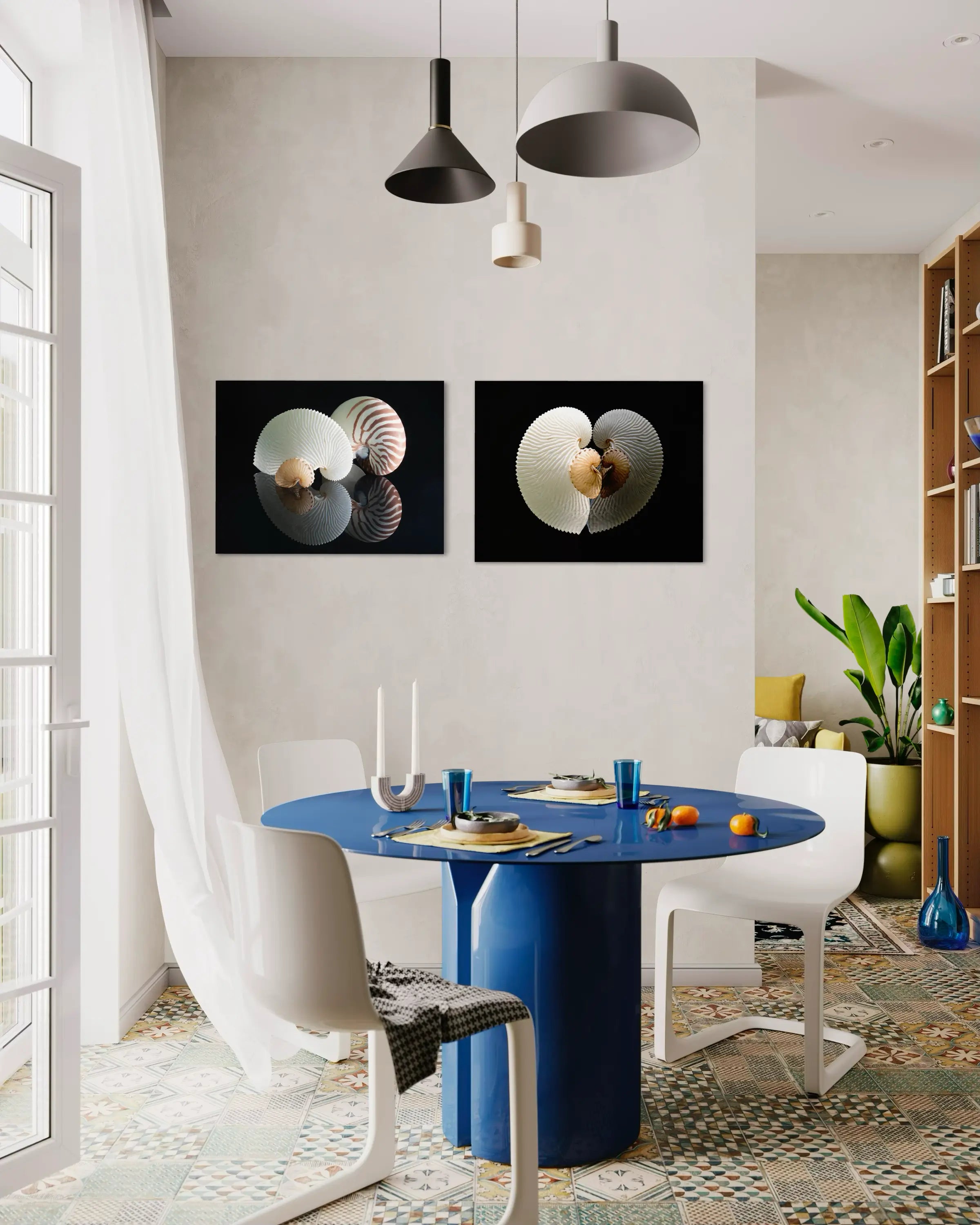 Three nautilus shells with unique patterns on a reflective black glass surface, coastal kitchen with another print