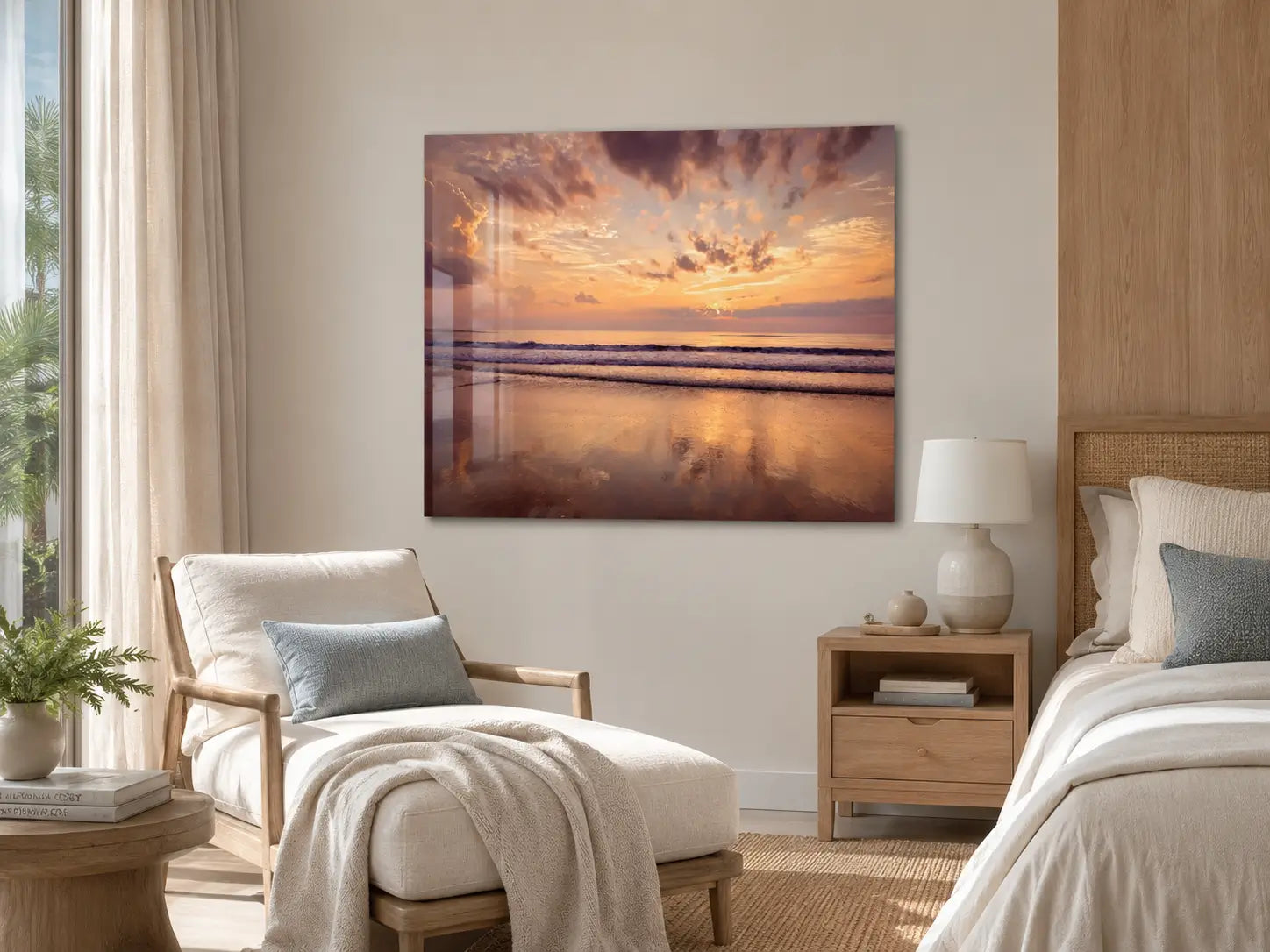Coastal bedroom with a Corolla Beach sunrise glass print on the wall, a chair, and a bed.